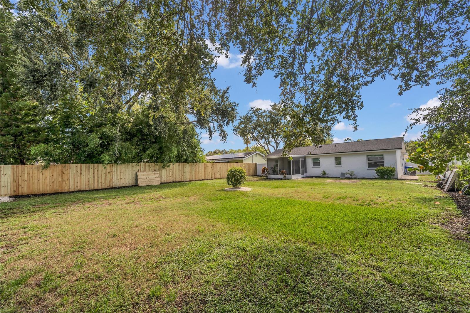 Spacious landscaped, fenced in yard full of possibilities!