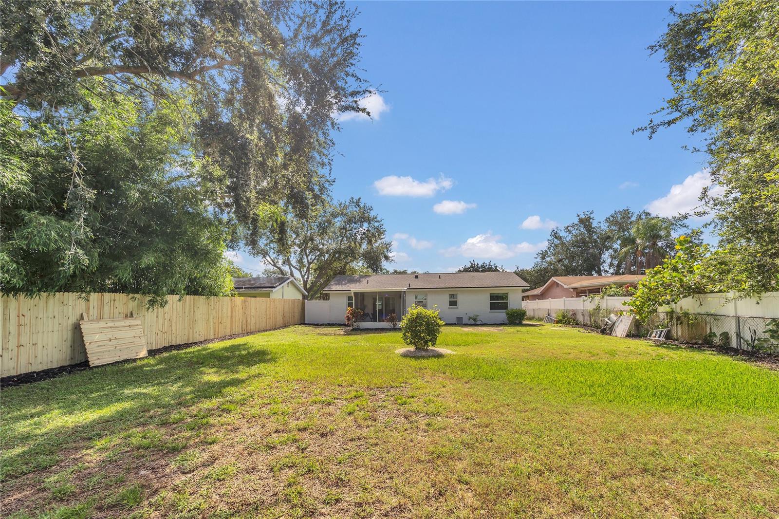 Spacious landscaped, fenced in yard full of possibilities!