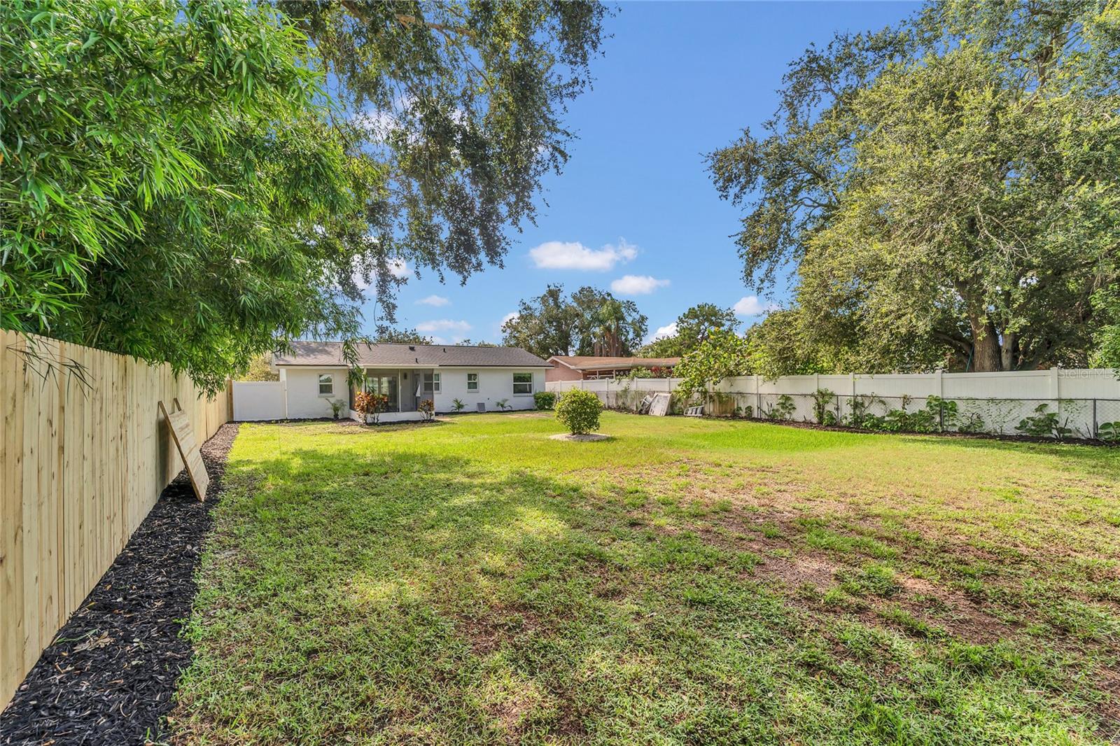 Spacious landscaped, fenced in yard full of possibilities!
