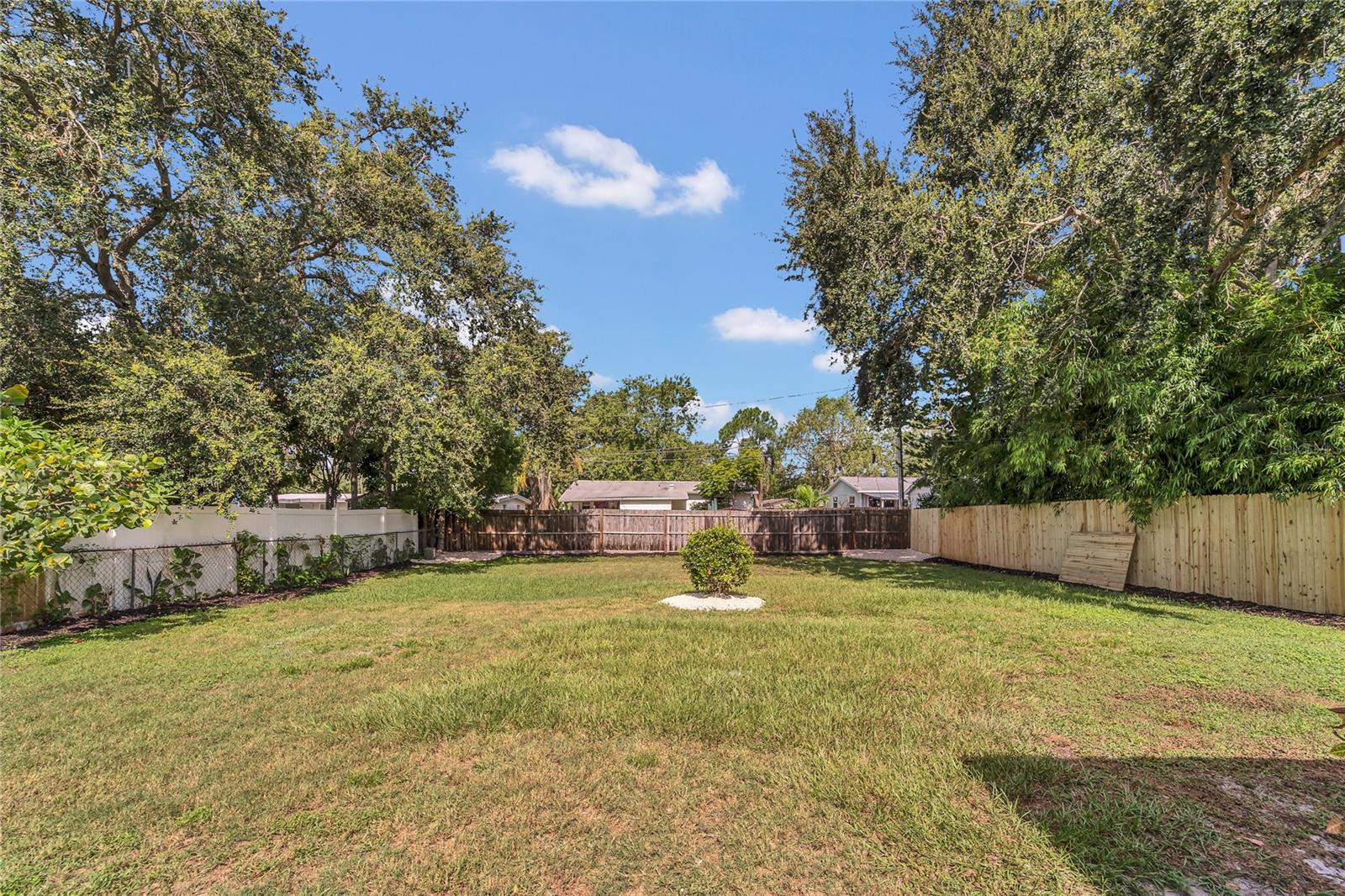 Spacious landscaped, fenced in yard full of possibilities!