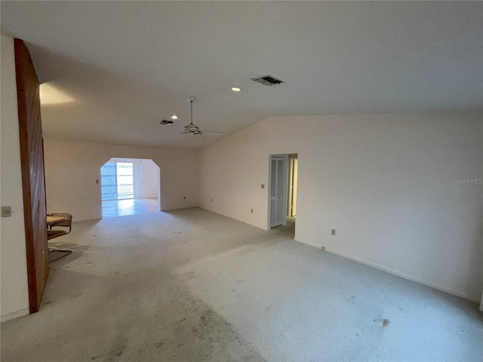 Living room with vaulted ceiling.