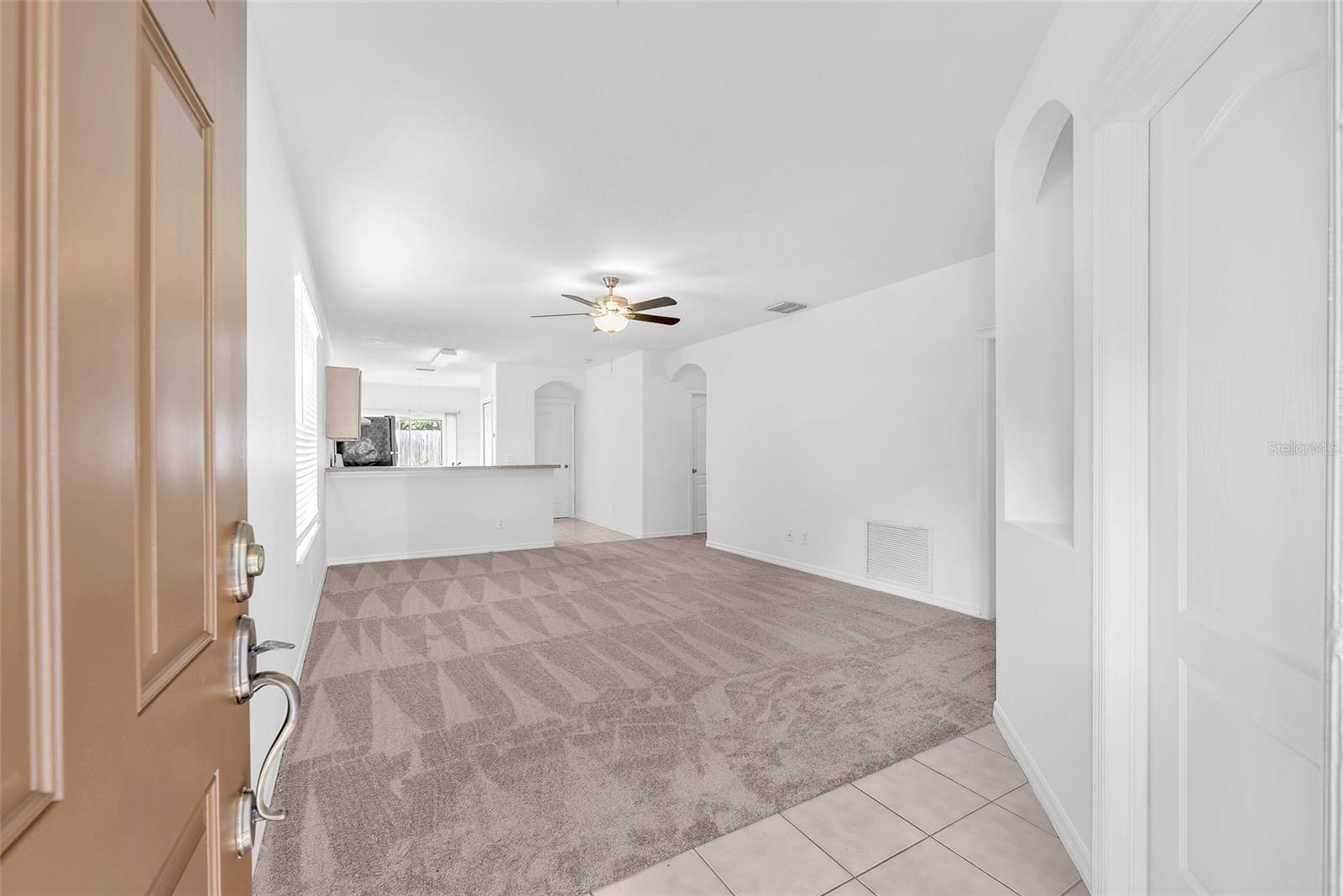 Great room plan with open kitchen makes the space feel larger