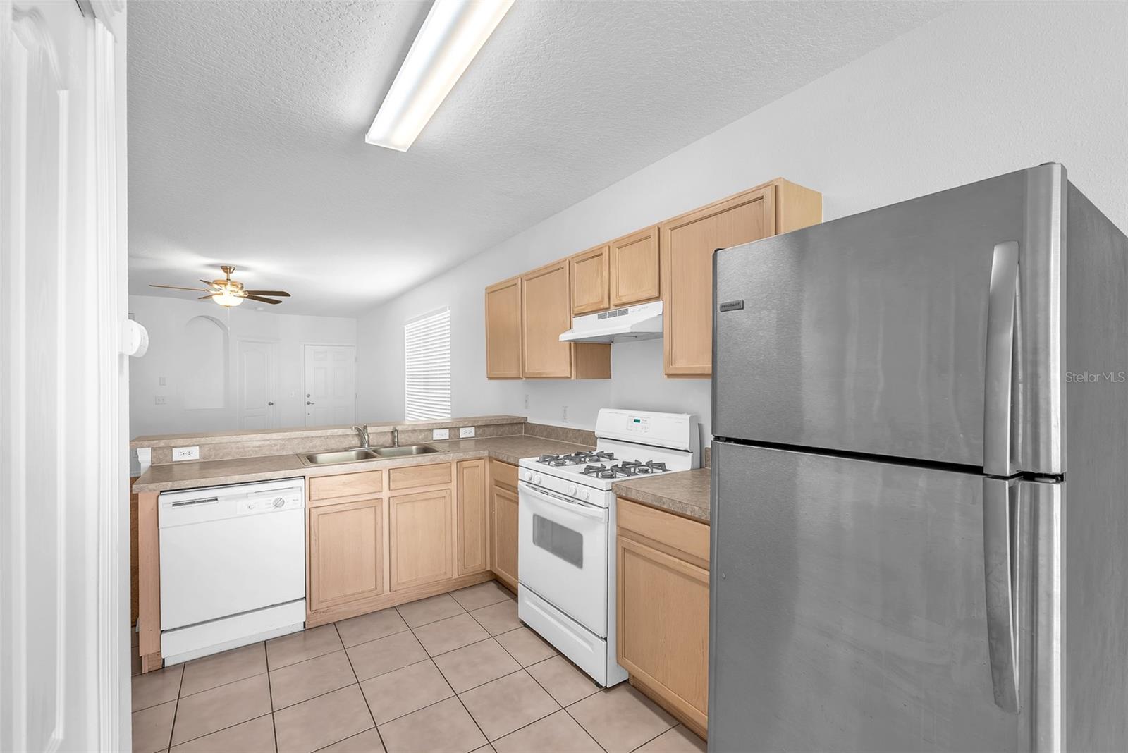 Kitchen is open to living room in an open great room plan