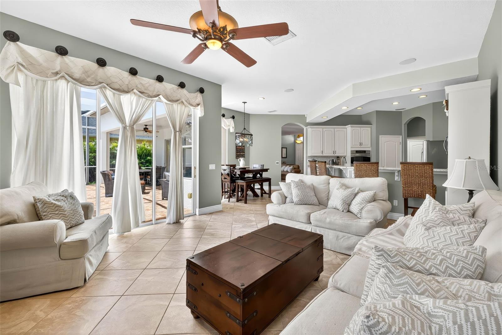 Family room with gas fireplace and access to pool