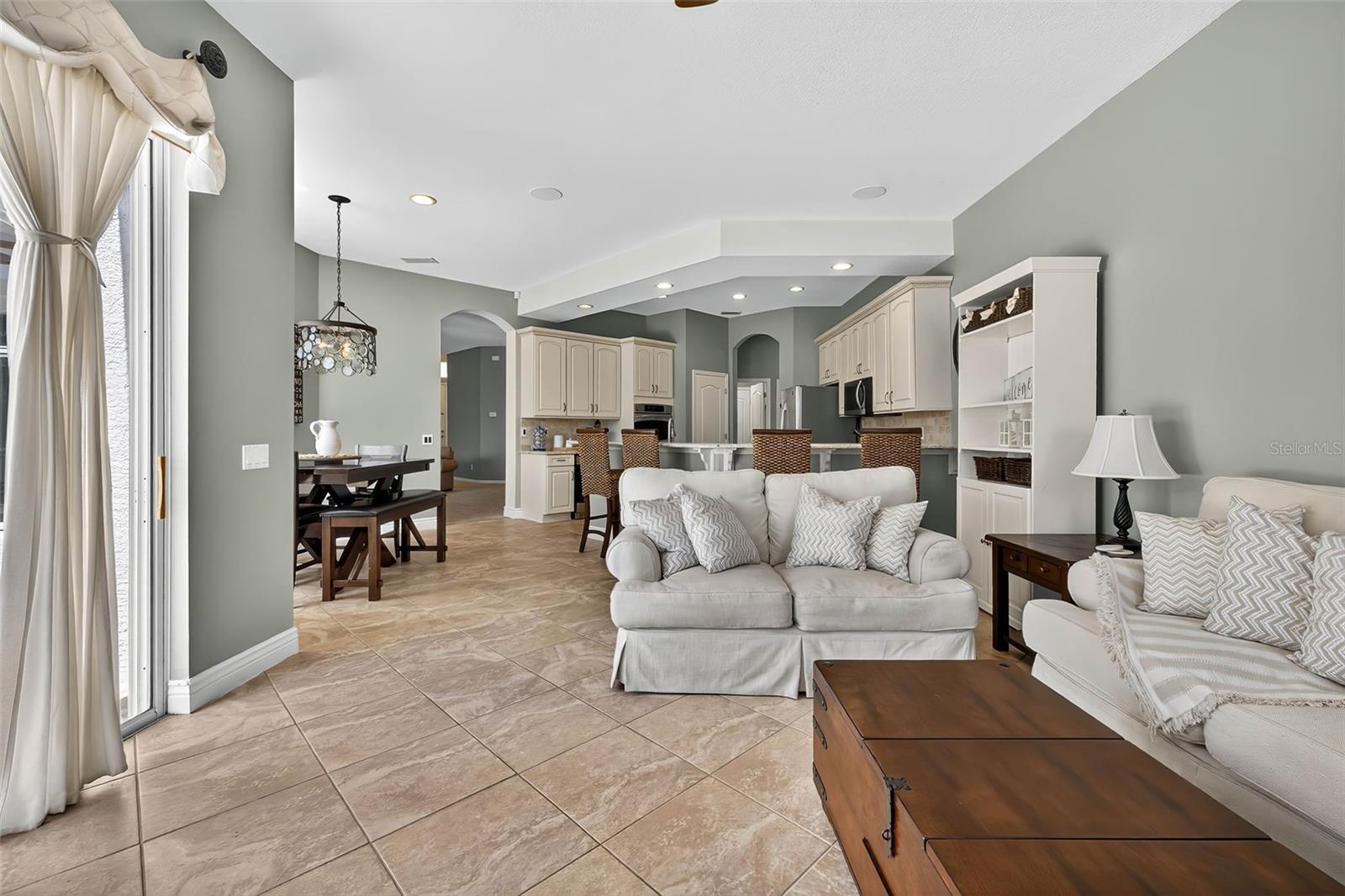 Family room with gas fireplace and access to pool