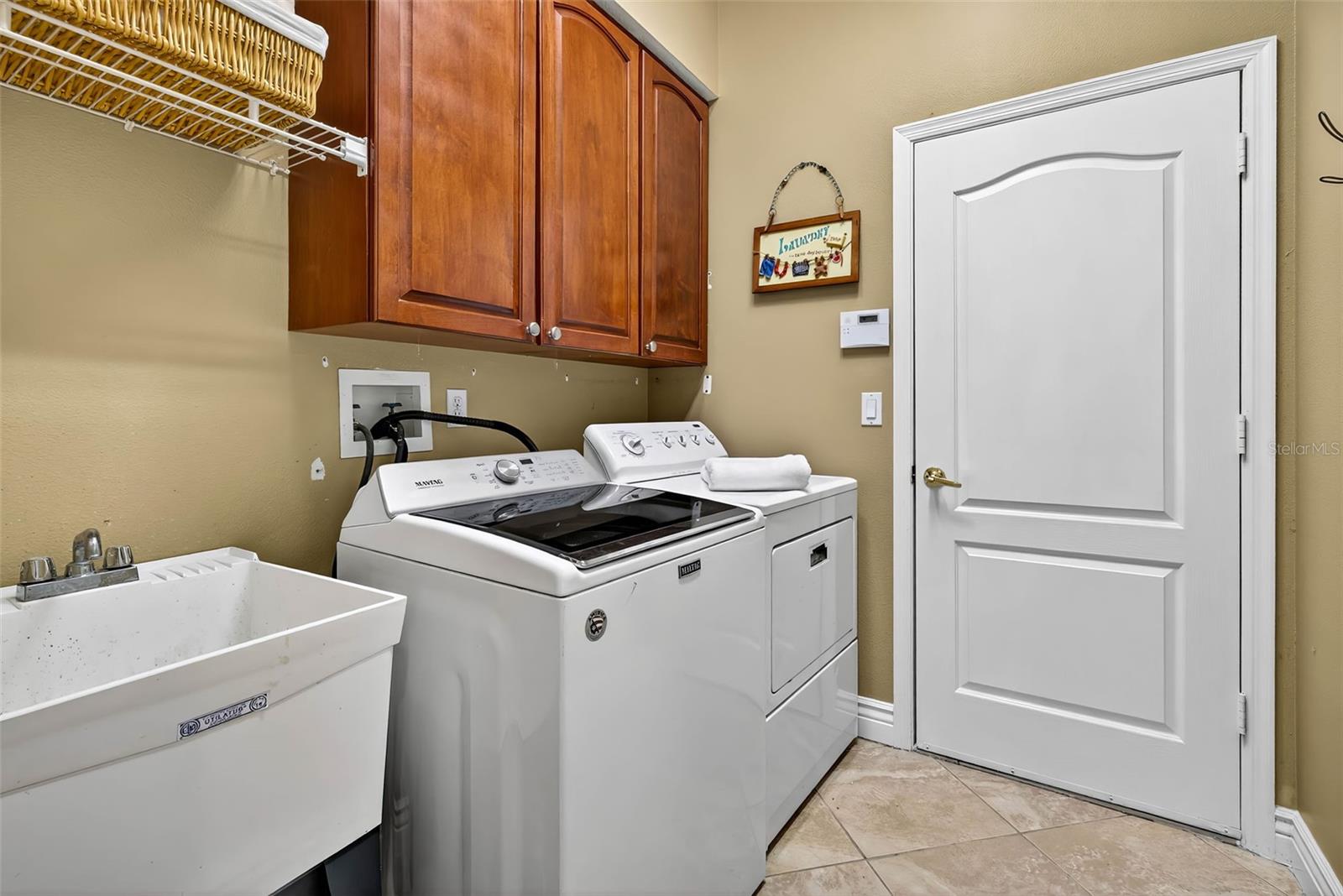 Laundry room adjacent to kitchen