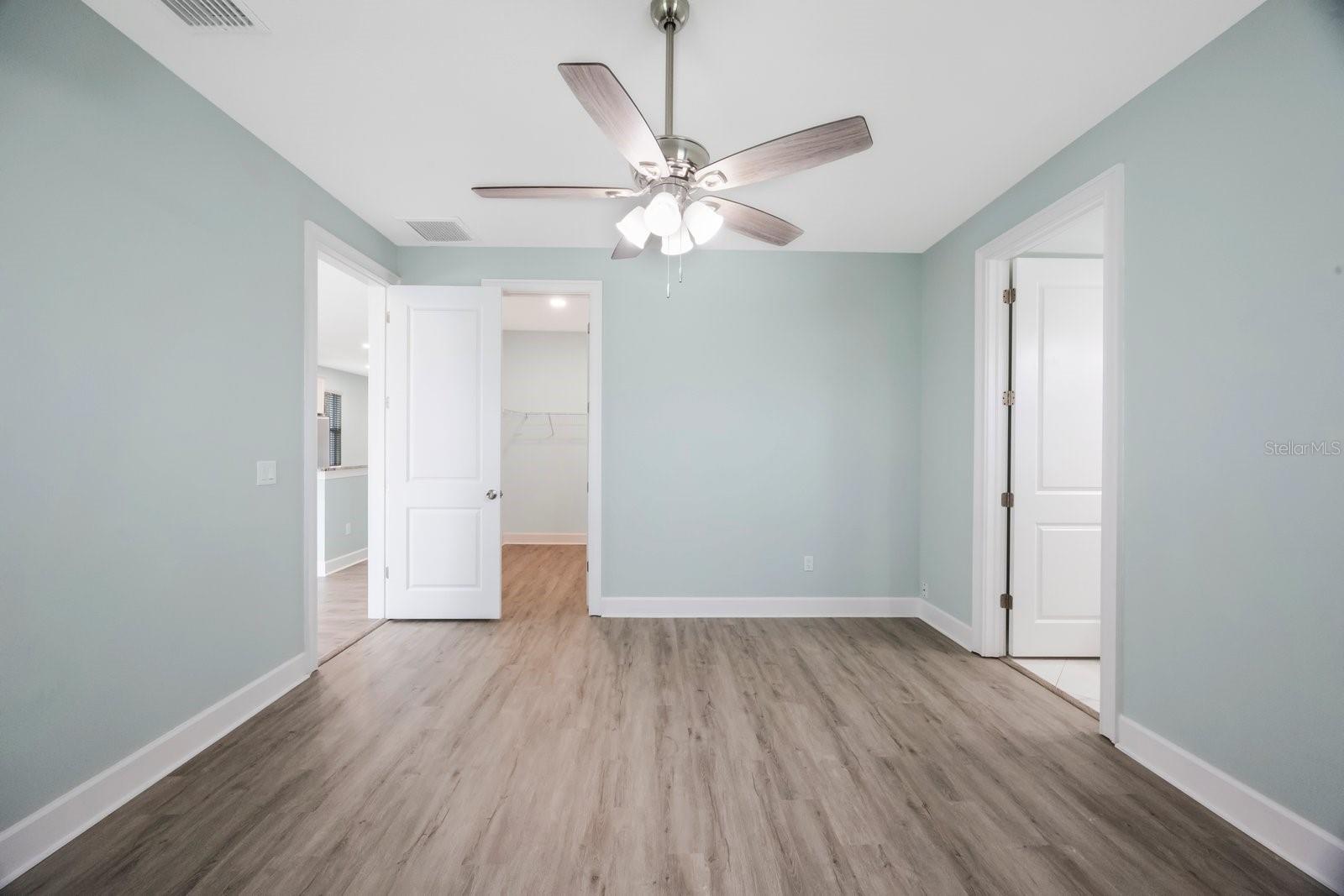 Primary bedroom with enough space for king bed, nightstands & additional furniture