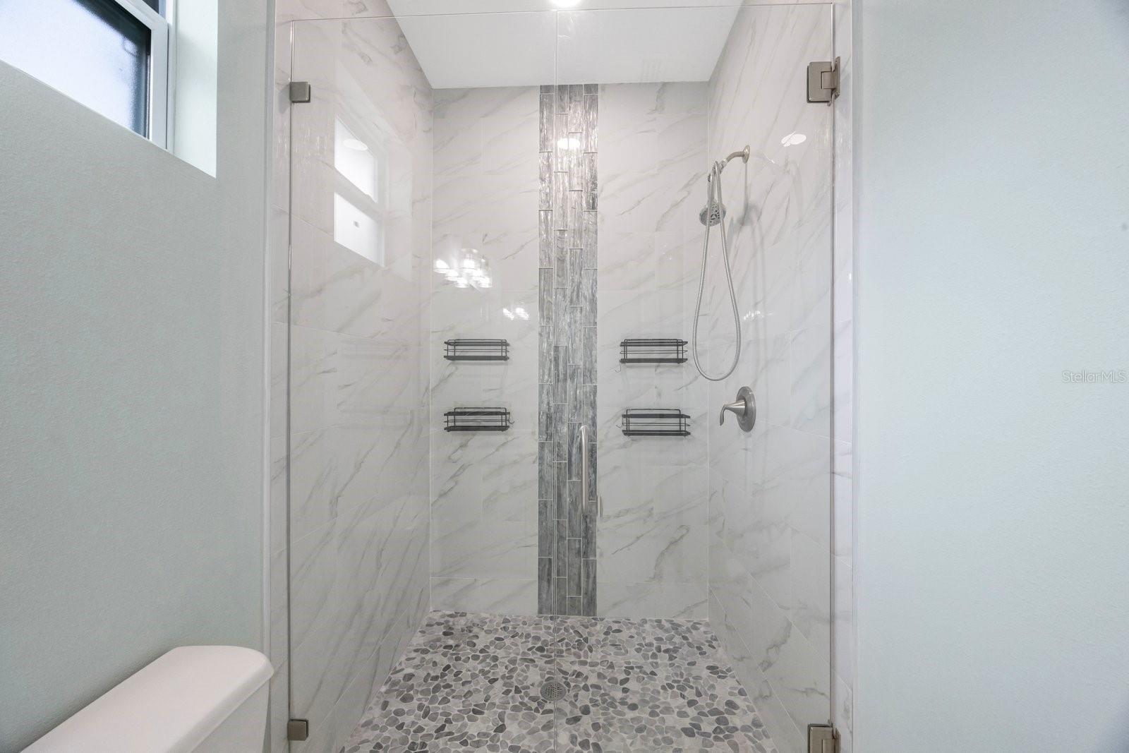 Primary bath with an inviting glass shower
