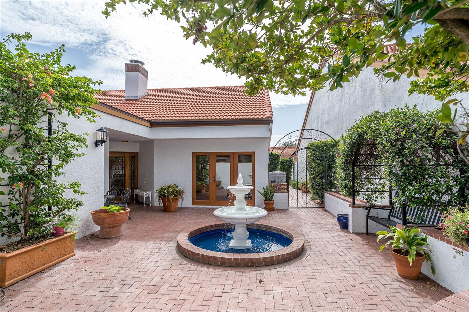 Front of home and courtyard