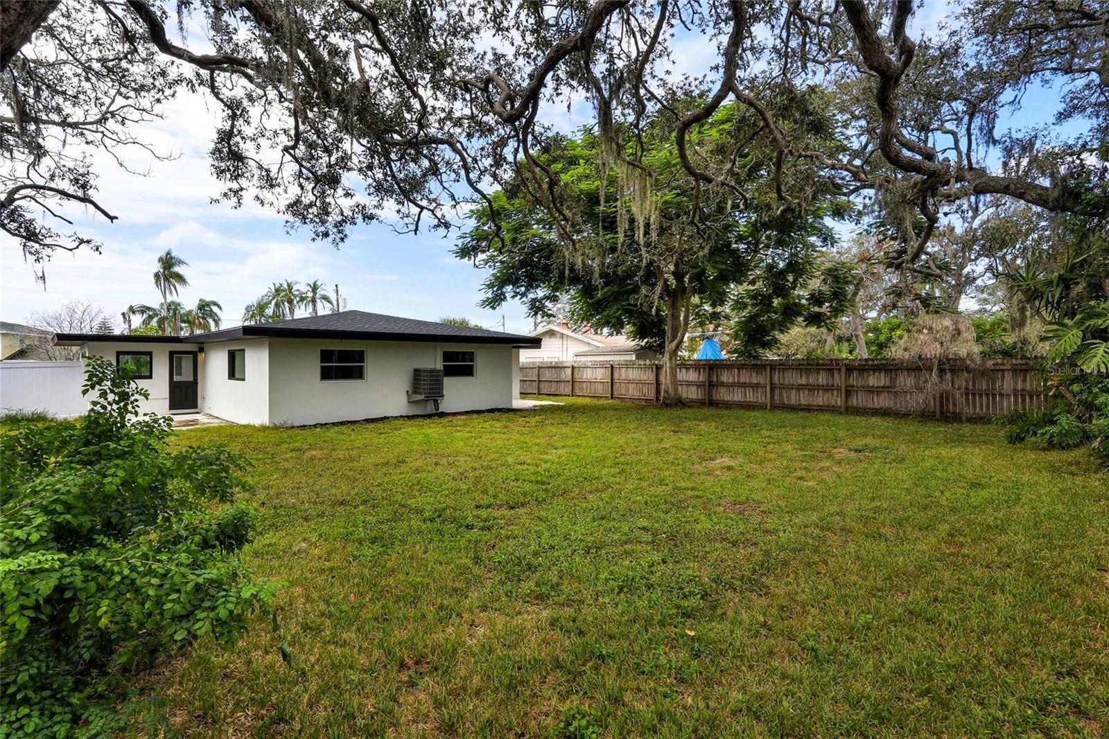 Huge backyard with rear gate entrance