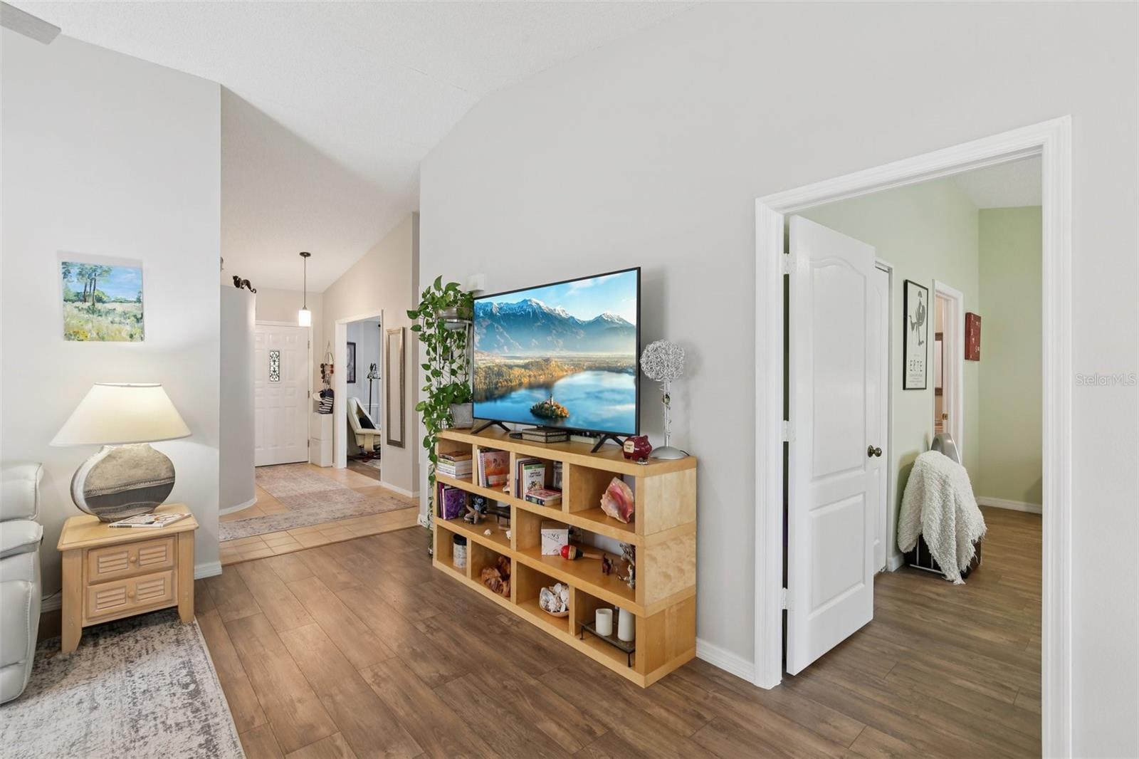 Partial living room with view of front door.