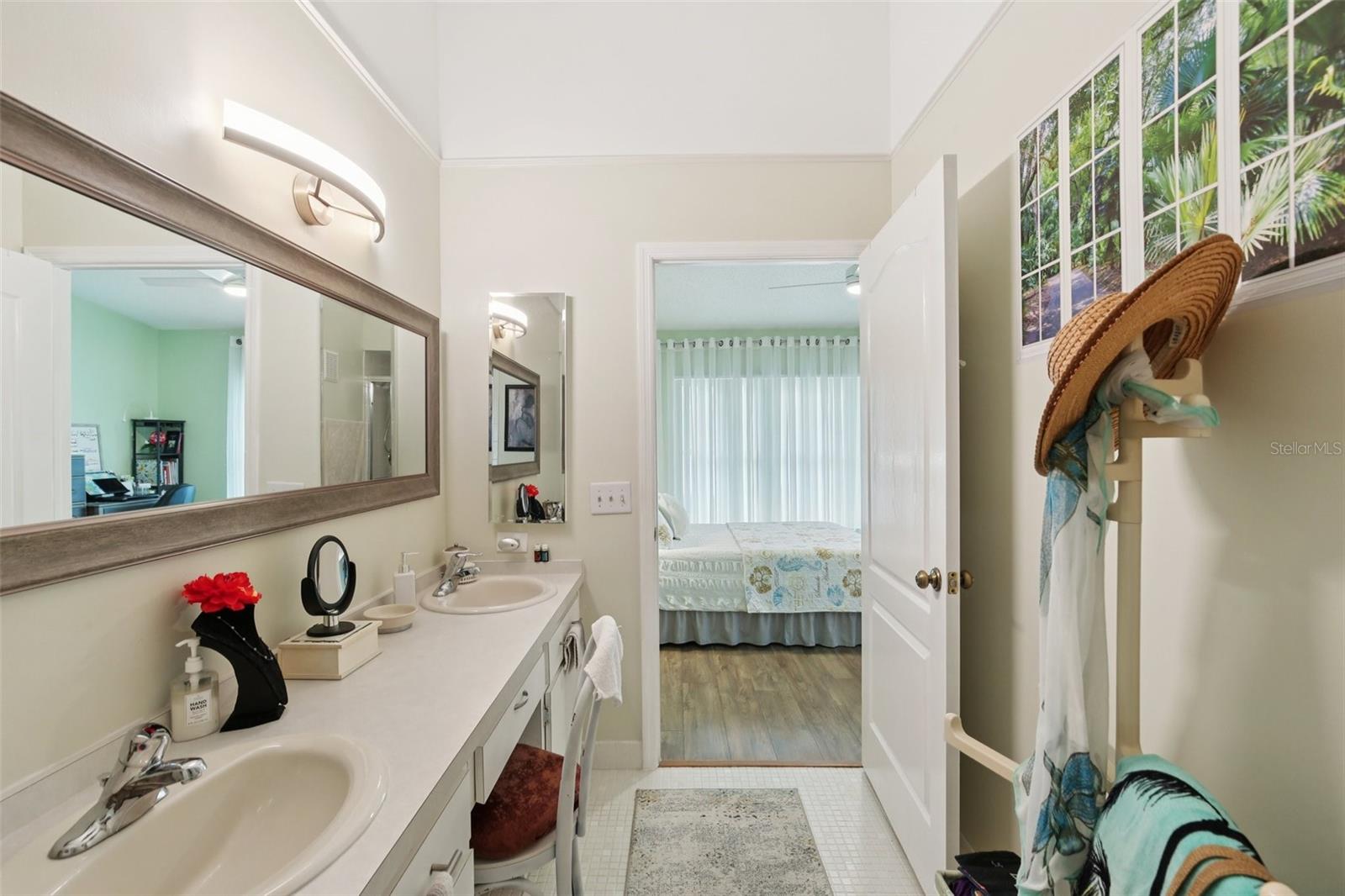 Master bathroom view into primary bedroom.