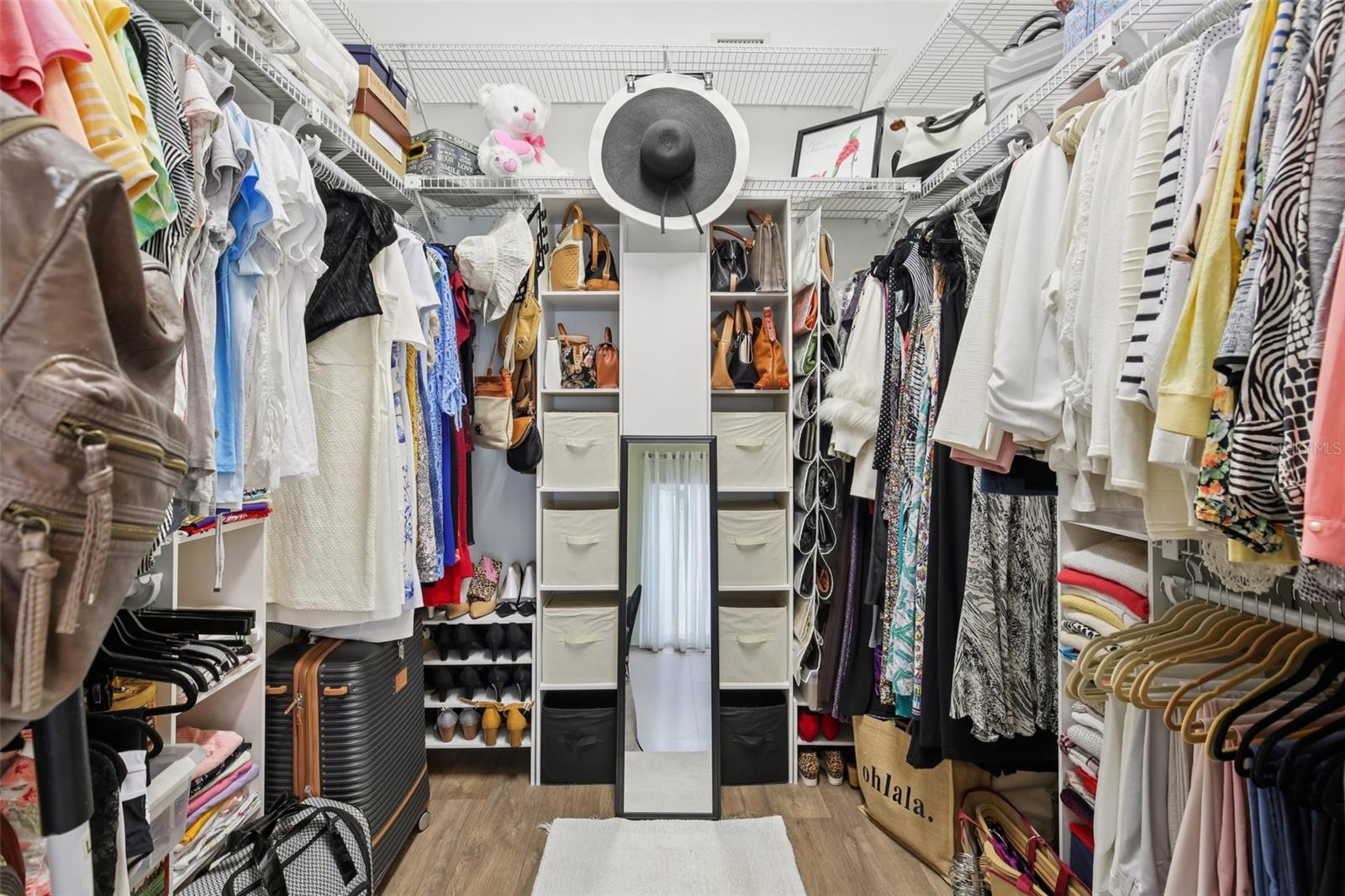 Huge walk-in closet in primary bedroom.