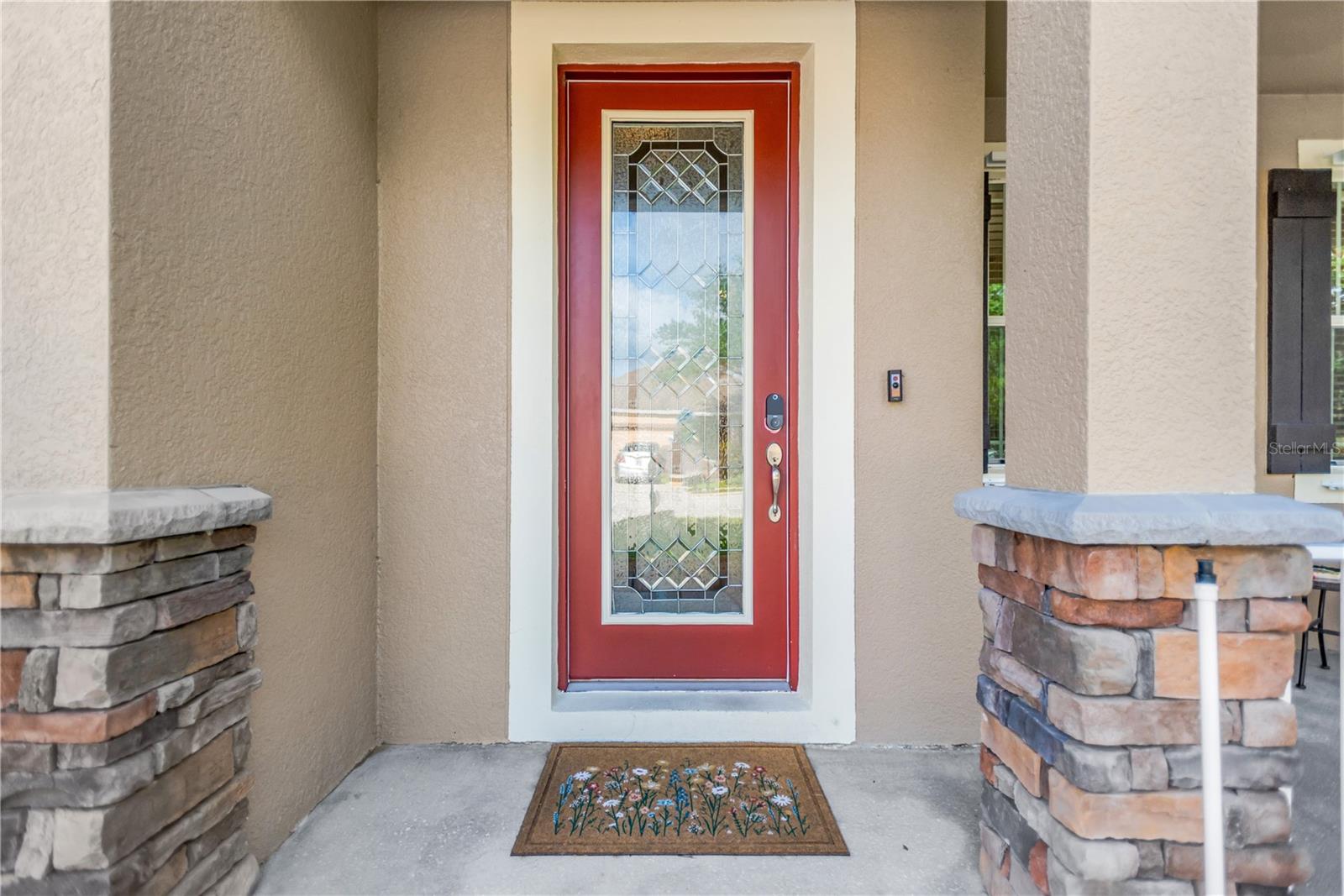 Beautiful leaded glass front door.Stone accents.