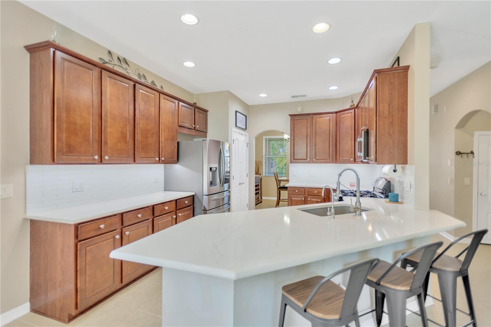 Gorgeous quartz countertops, large GRANITE farm style sink!