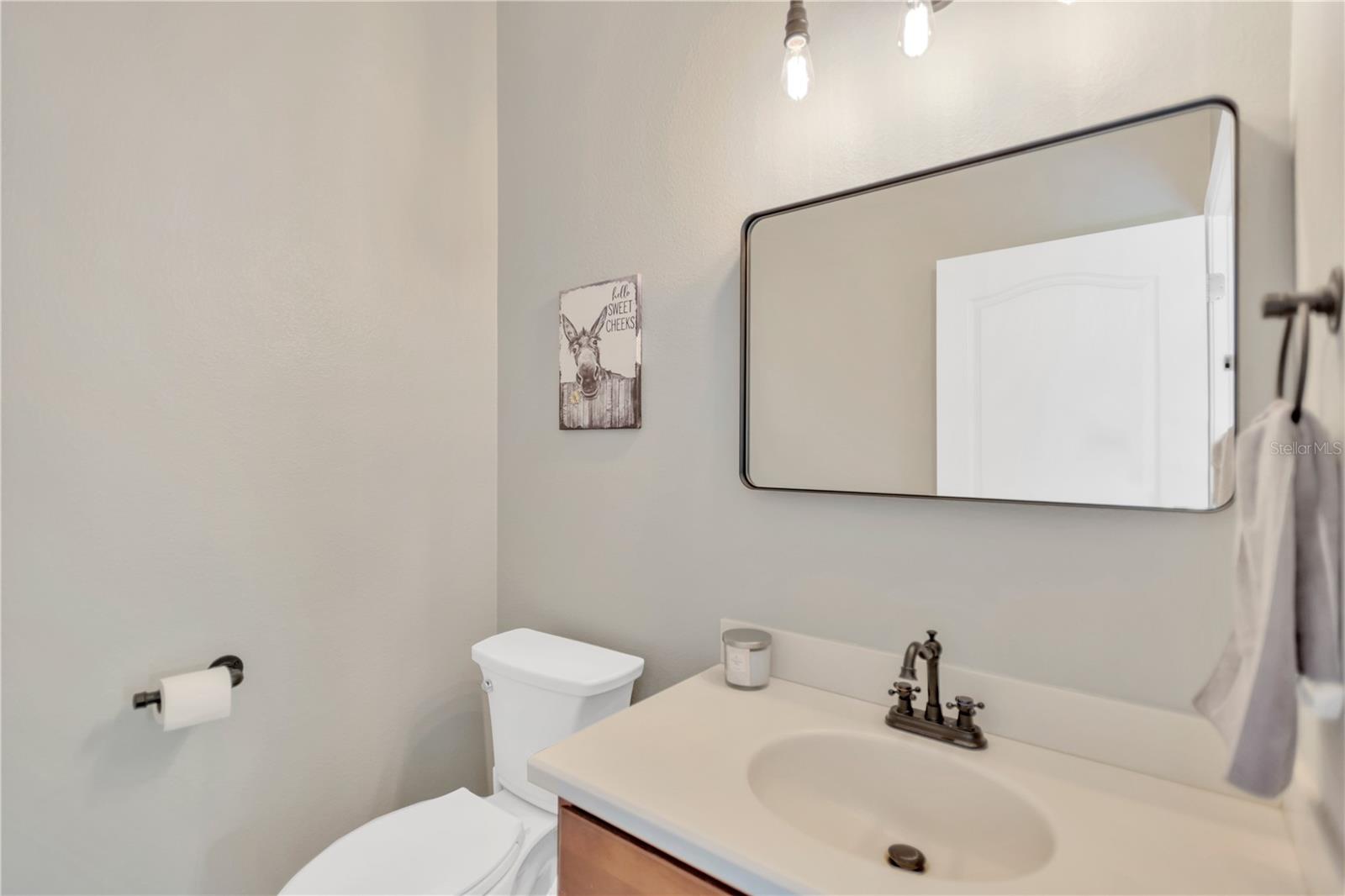 Half bath on first level, off of the great room. Perfect for a pool bath!