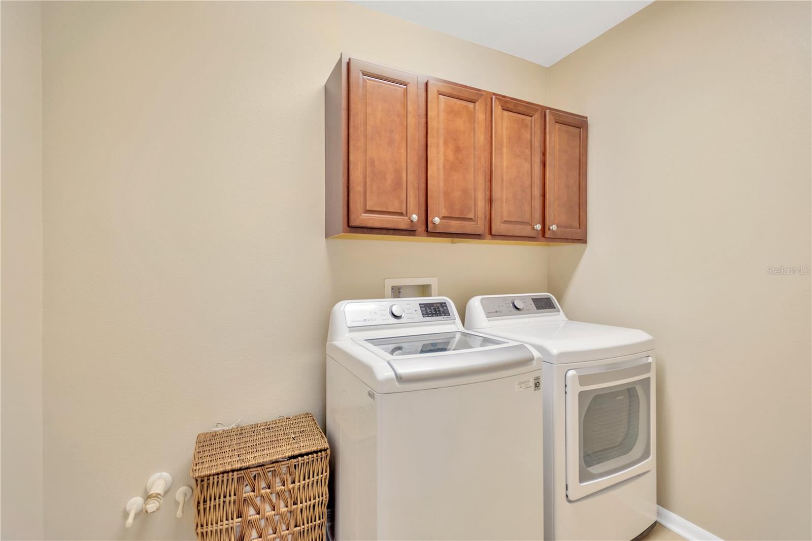 Second floor laundry room with cabinetry and plumbed for a sink!