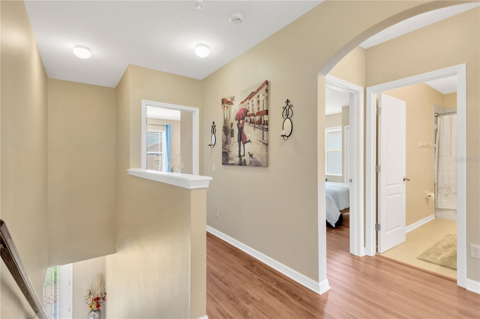 Beautiful LVP flooring in wide hallways.