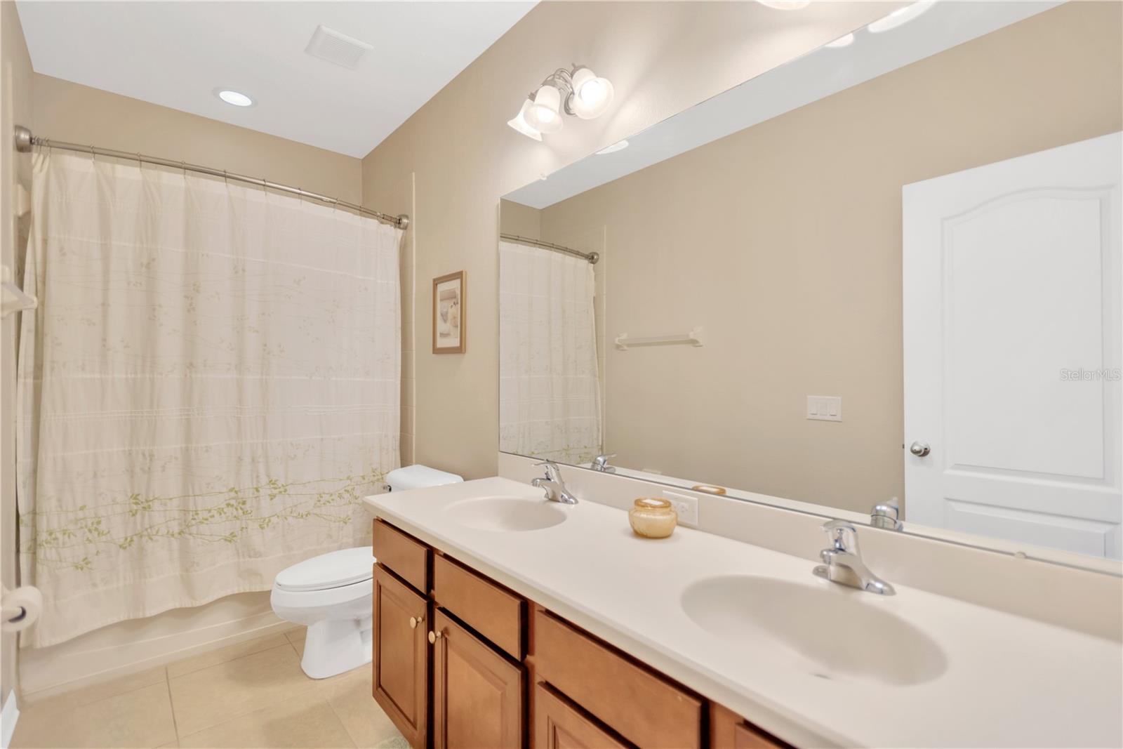 Jack and Jill bathroom services bedrooms 2&3.Double vanity sinks, tub/shower.