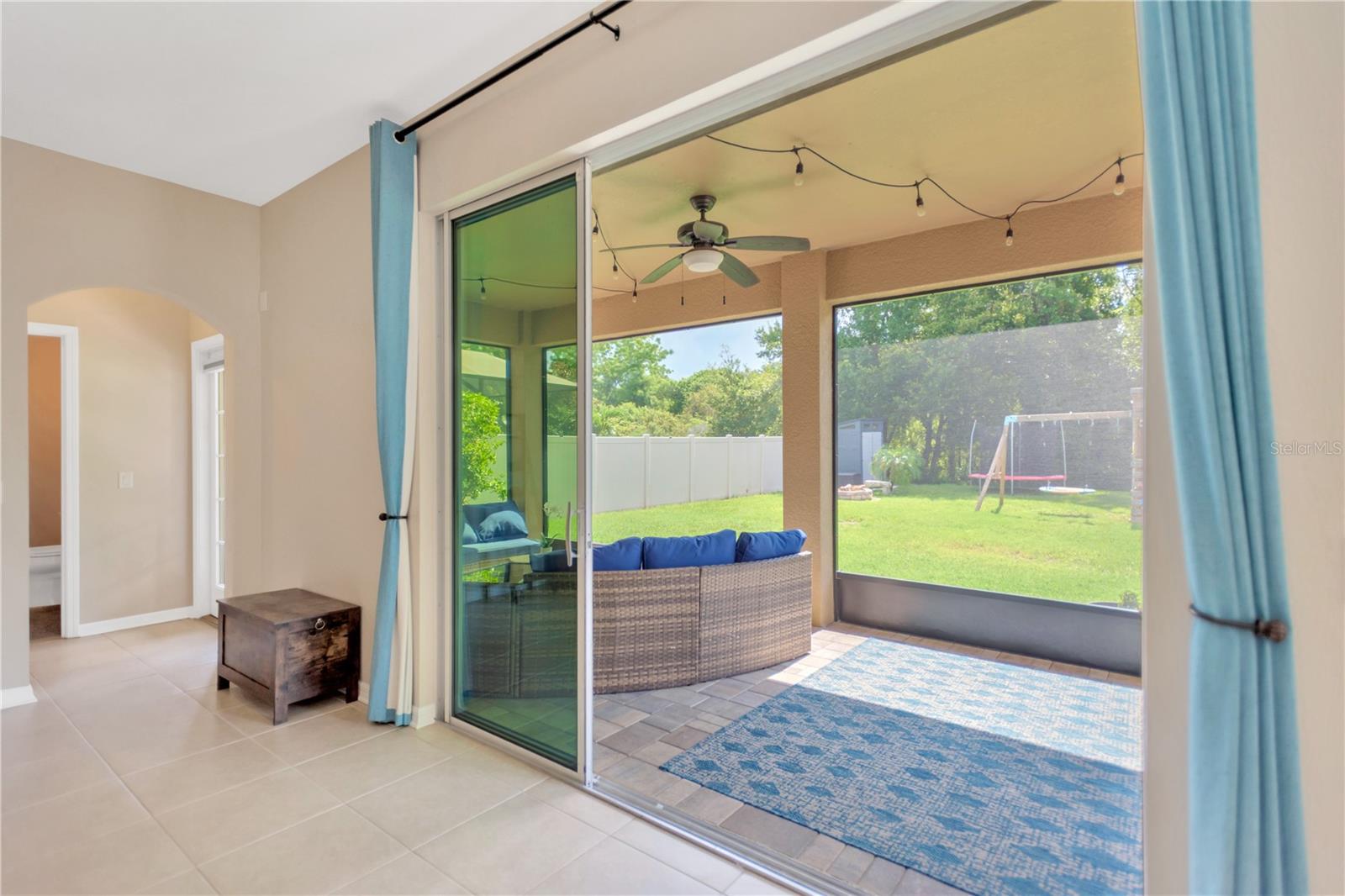 Pocket sliders lead to large screened in lanai.