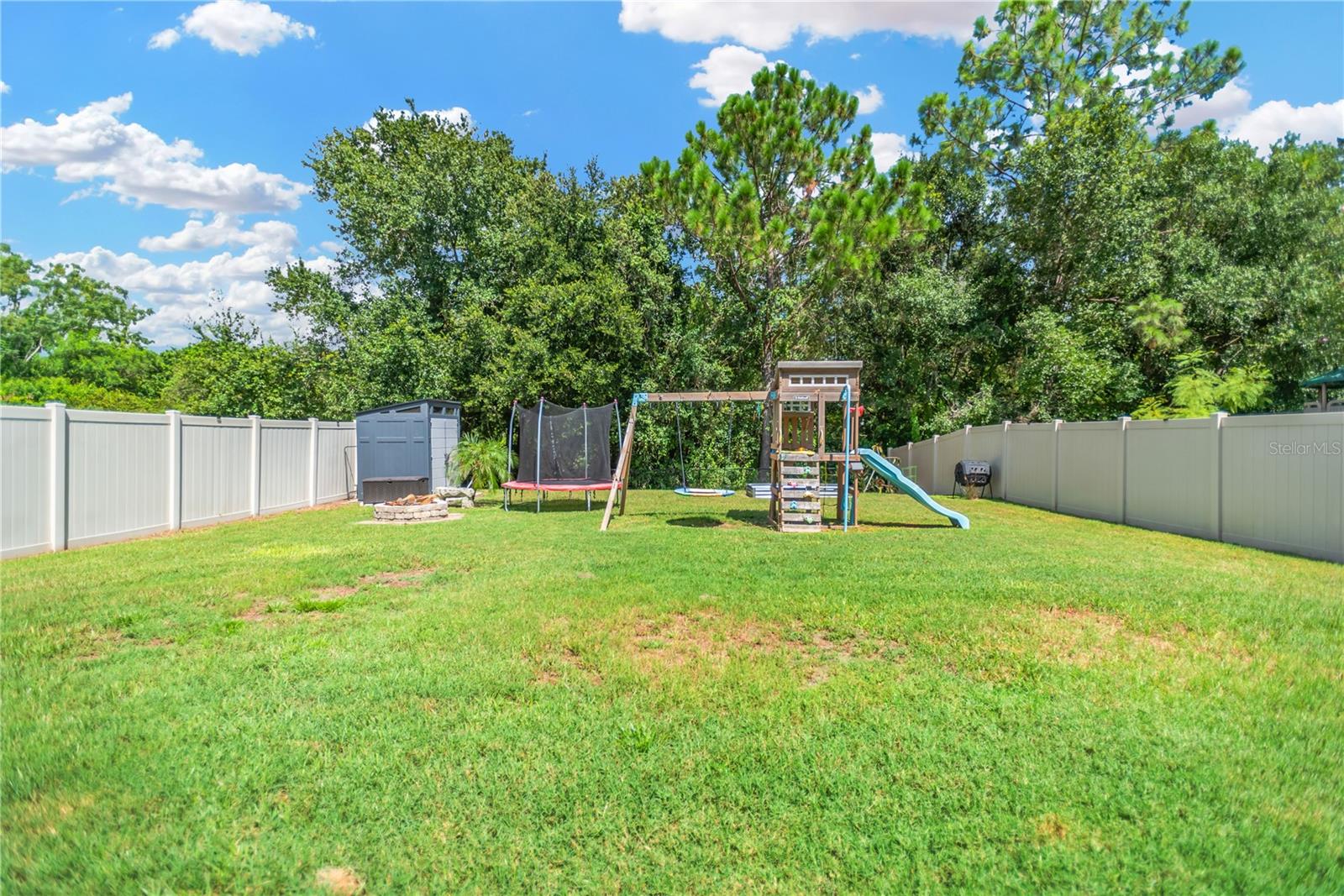 New Vinyl privacy fencing on both sides. Swing set stays!
