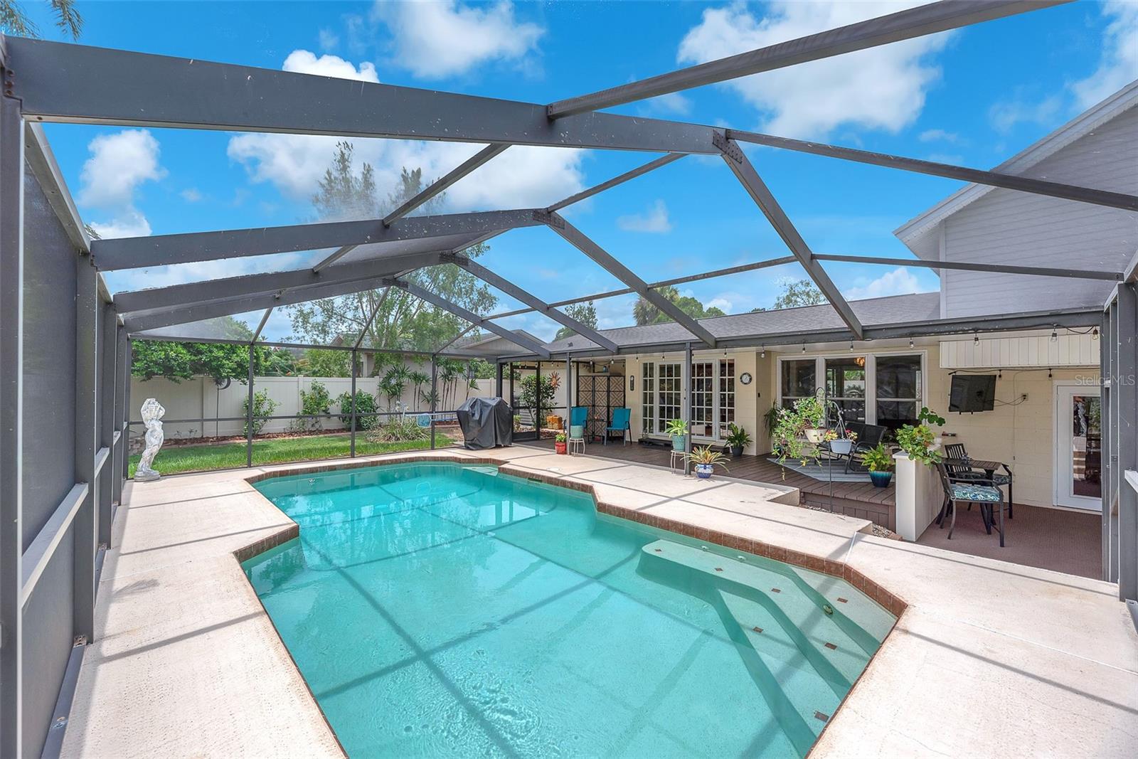 Heated Pool with screen enclosure and 2 back yard porch areas for entertaining.