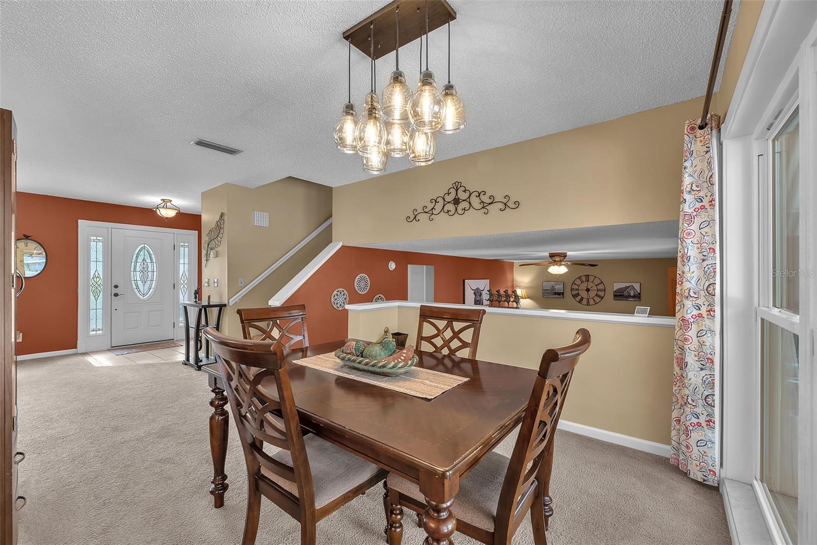 The dining room has a peek through into the lower level family room to keep the conversations flowing.