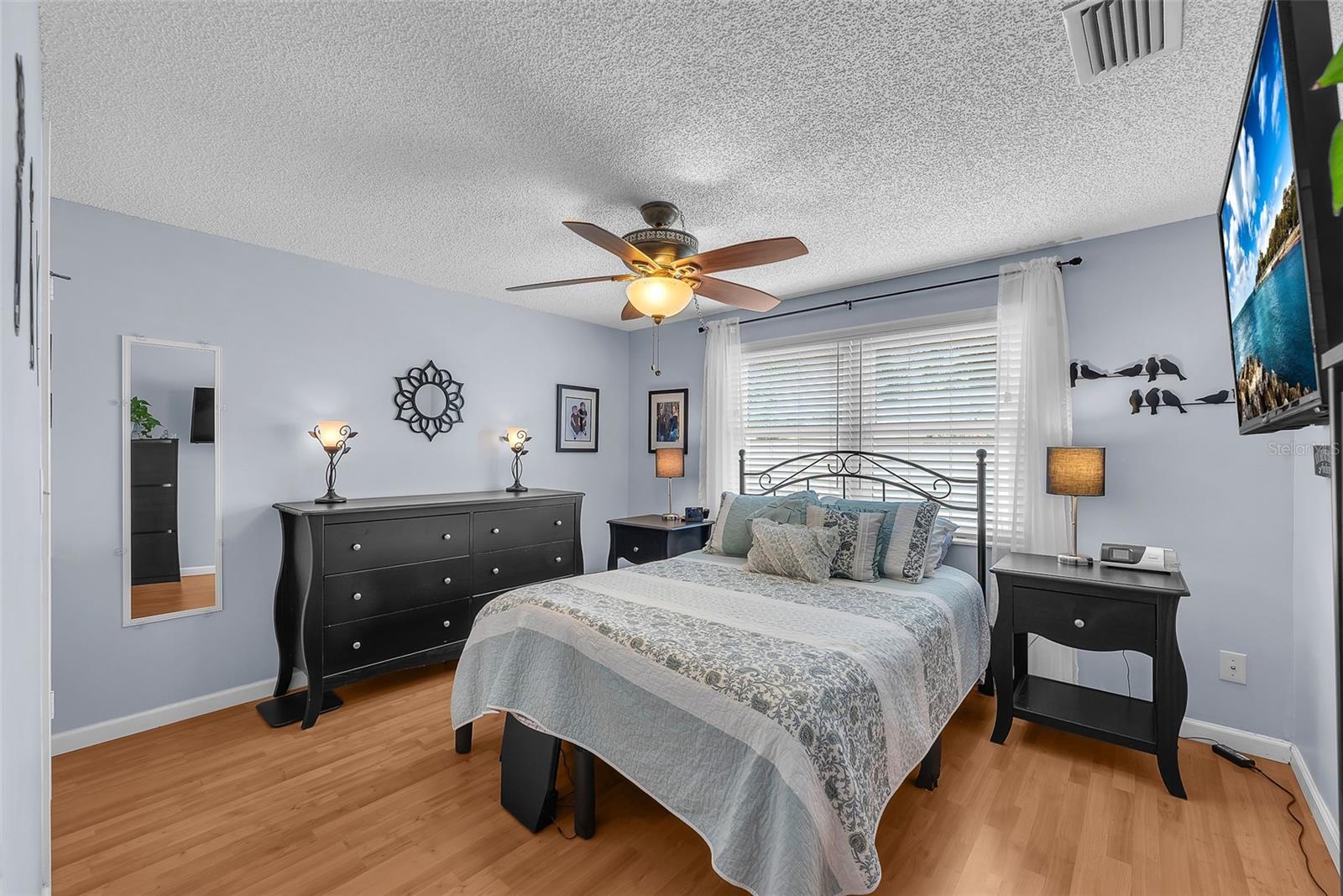 The Lower level bedroom is 12.5 x 11 and has a walk-in closet and access to a full bathroom making it perfect for guests or a second primary suite.