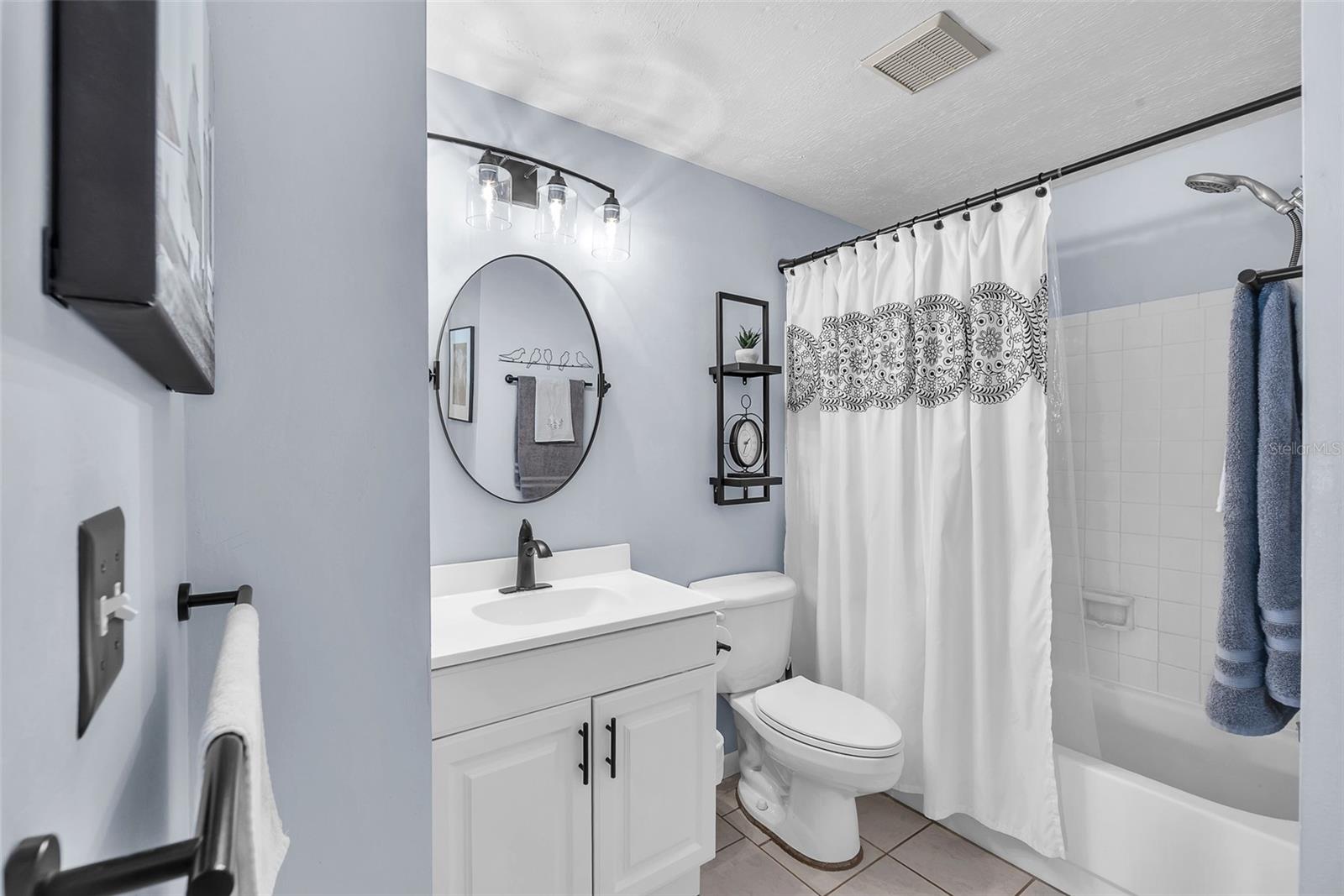 The Lower level bathroom has been tastefully updated and has a tub/shower combination.