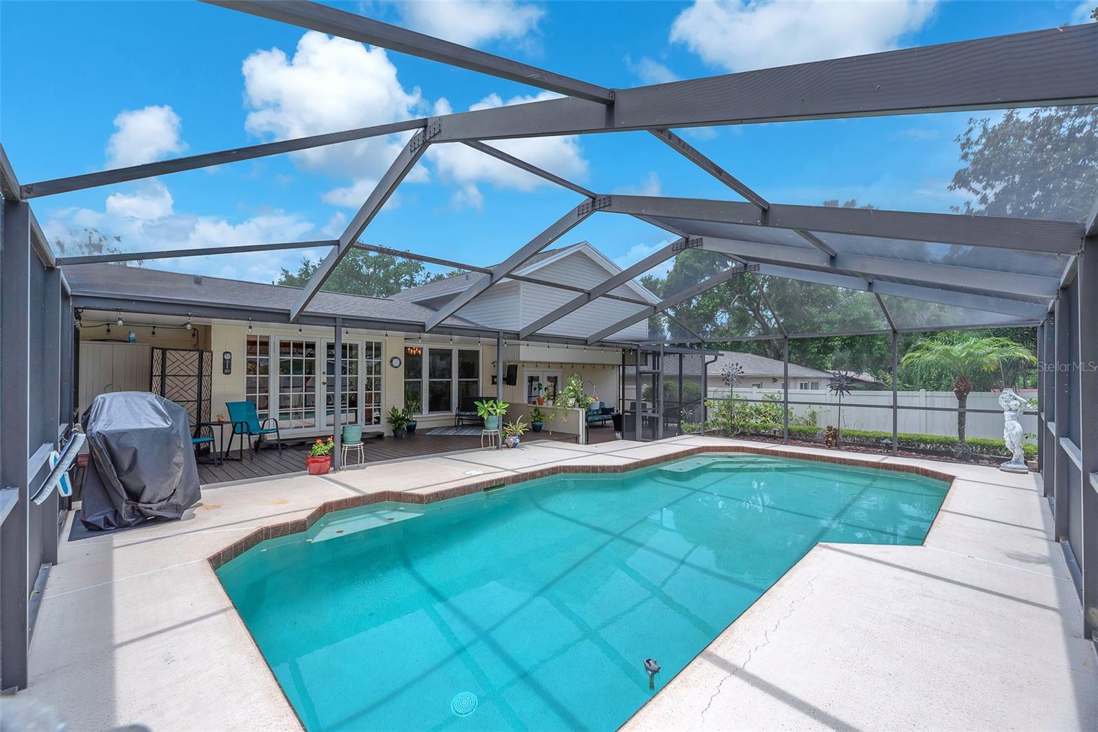 You will love cooling off in this large screened-in pool that is heated for those cooler months in Florida.
