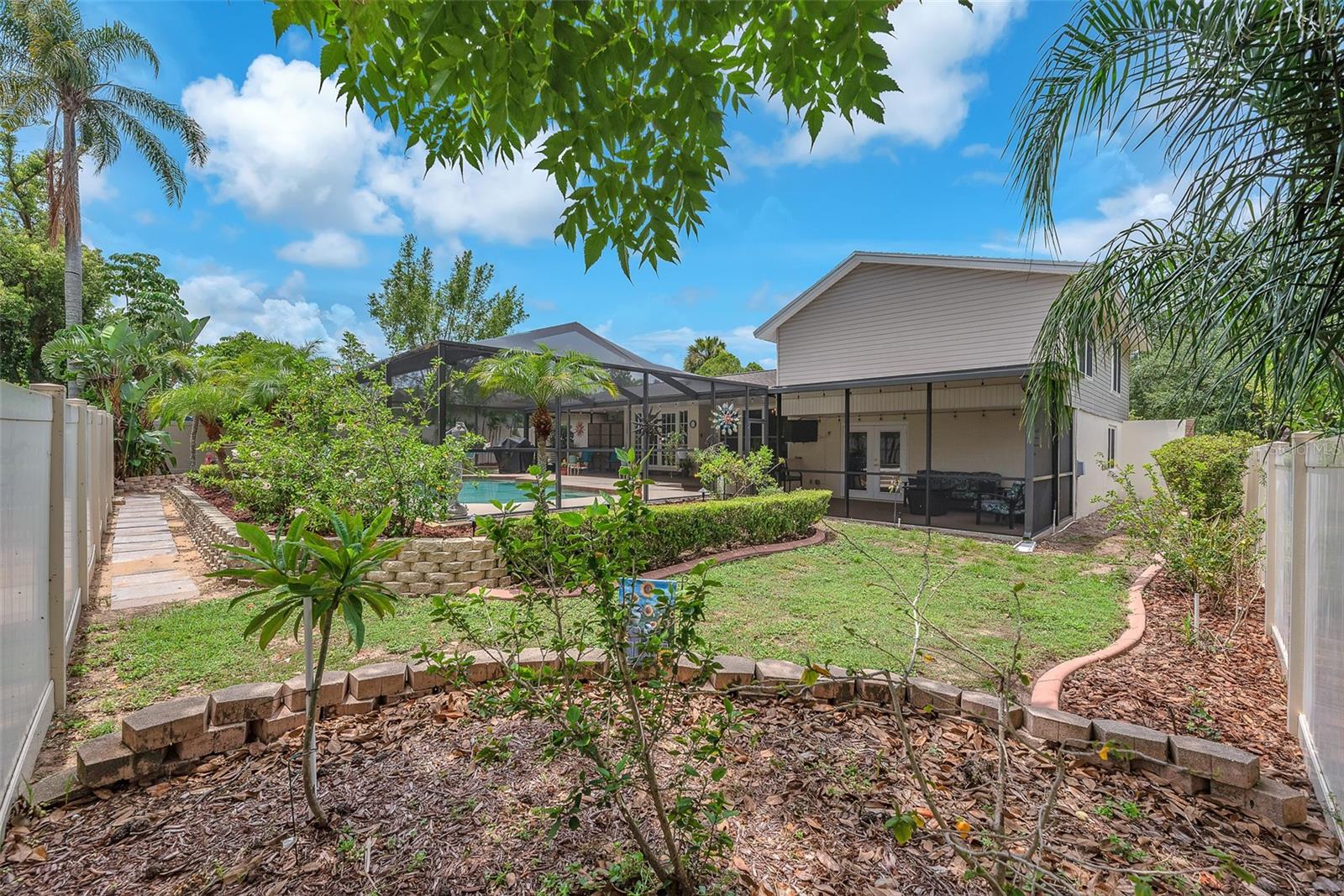 View from another side of the back yard with plenty of green space for a furry family member.
