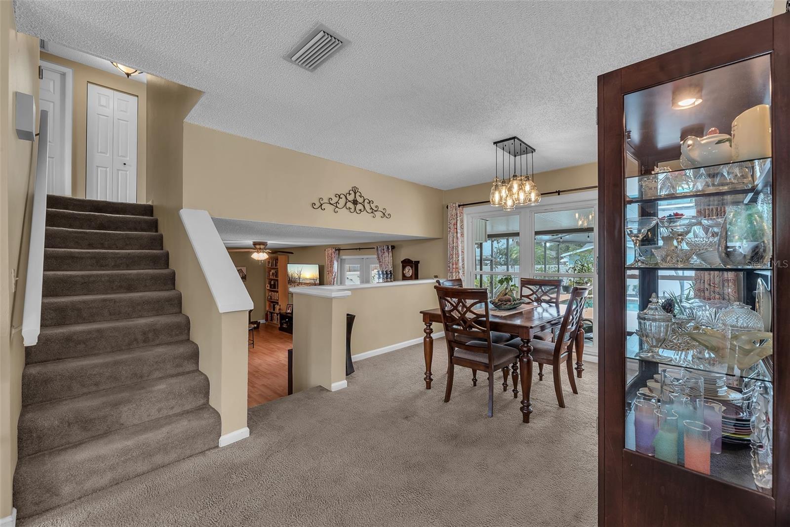 You enter this tri-level home in the living room, Dining room & Kitchen.  The lower level has a large family room with french doors opening to a private back screened porch, a spacious bedroom & a full bathroom. The upper level has 3 generous bedrooms and 2 full bathrooms.
