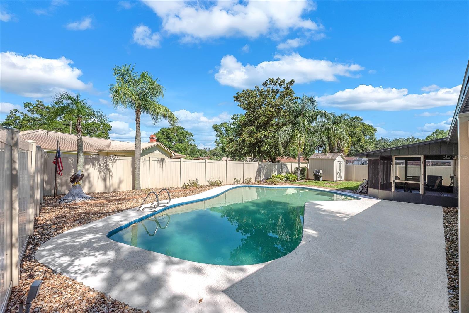 This back yard oasis has a private in-ground pool, a 22 x 10' screen porch for grilling & chilling, PVC fence for privacy and a 10x8’ storage shed, perfect for tools or hobbies, plus ample space for pets and play.