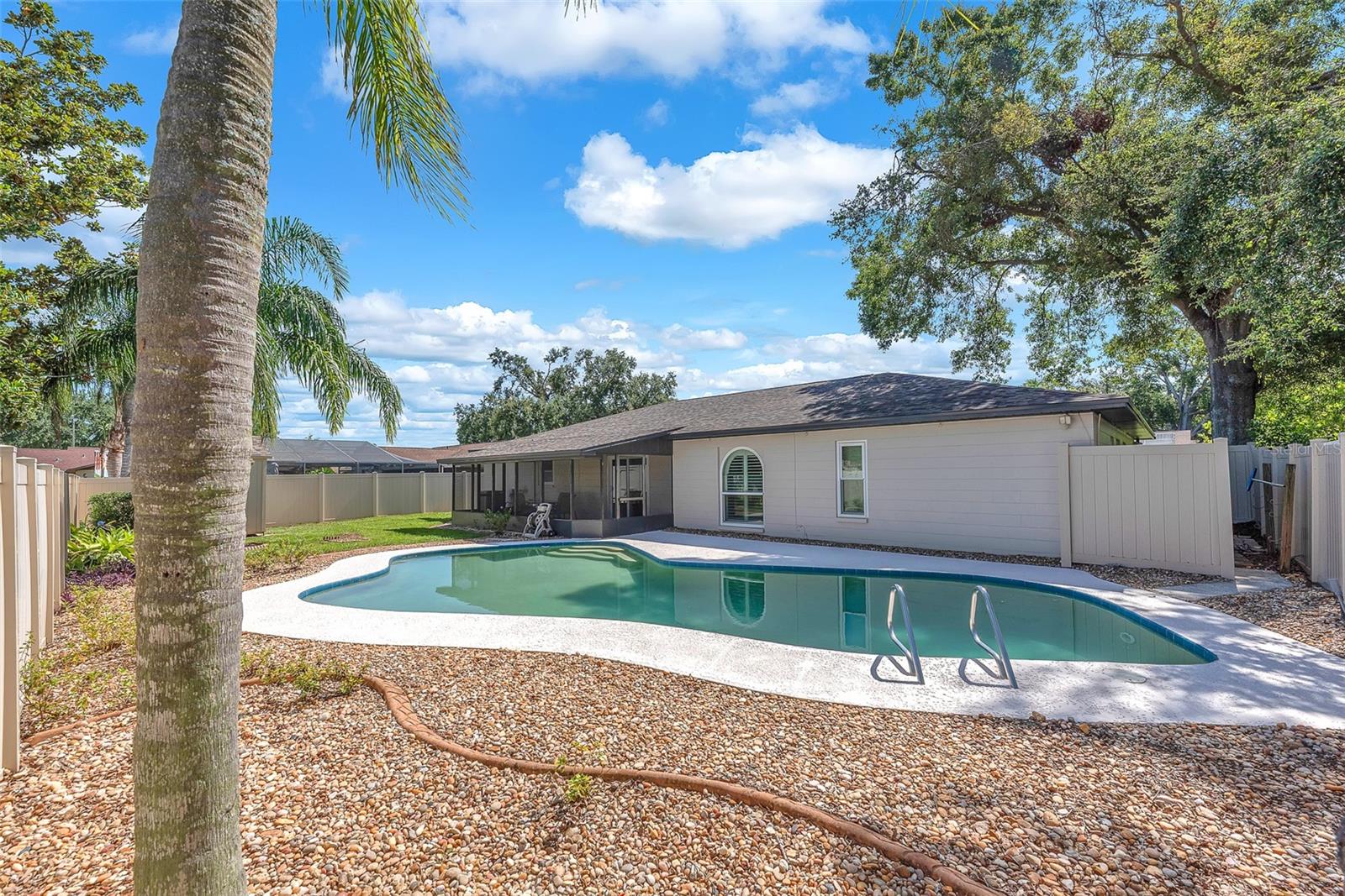 The perfect space for entertaining, this impressive backyard and pool area is ready for your next celebration.