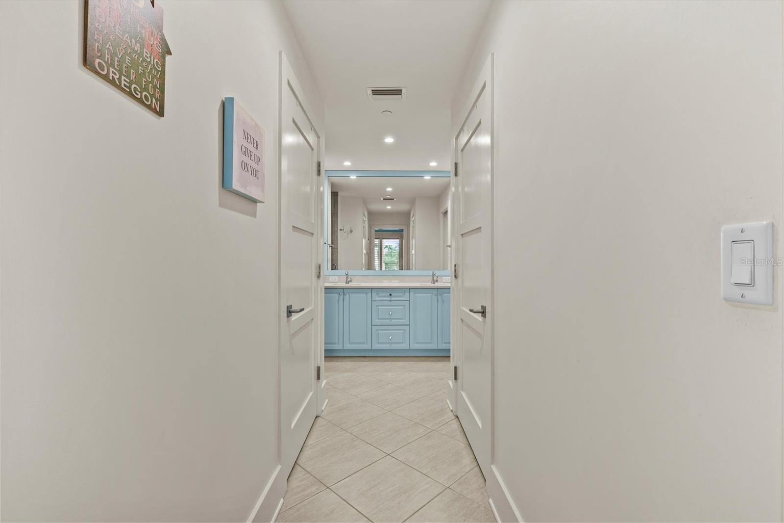 To Primary Bath Dual Closets on either side
