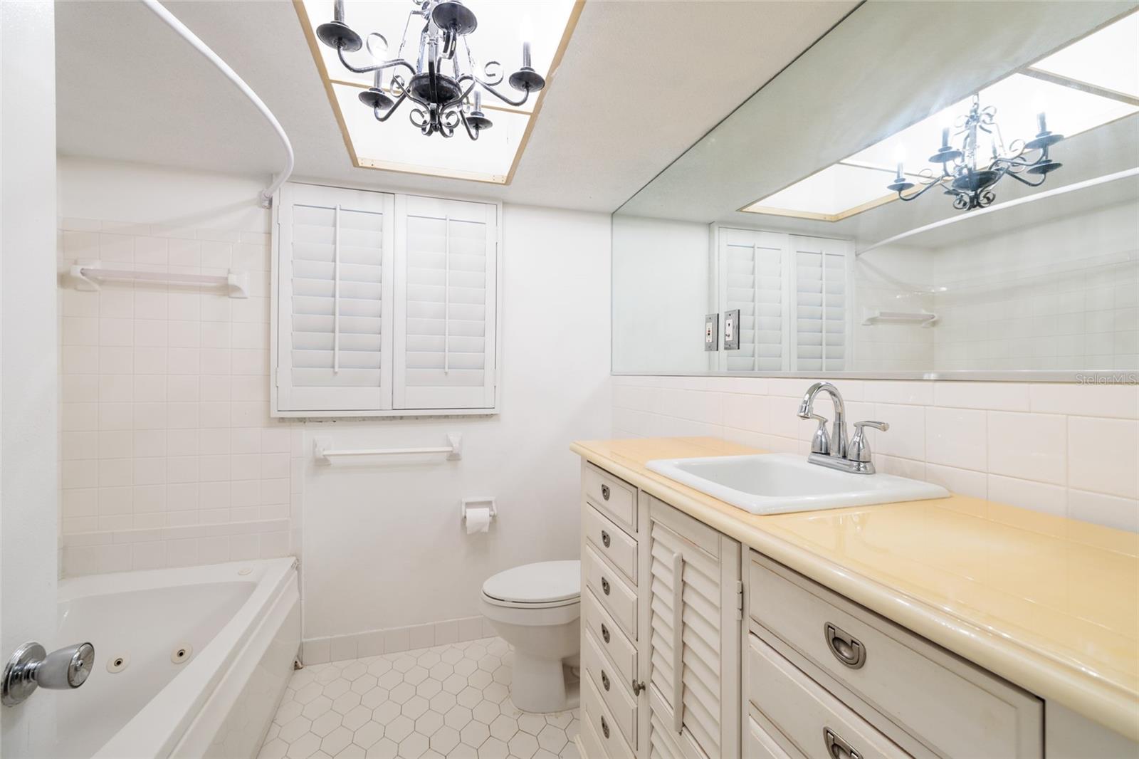 Hall bath with tub and shower