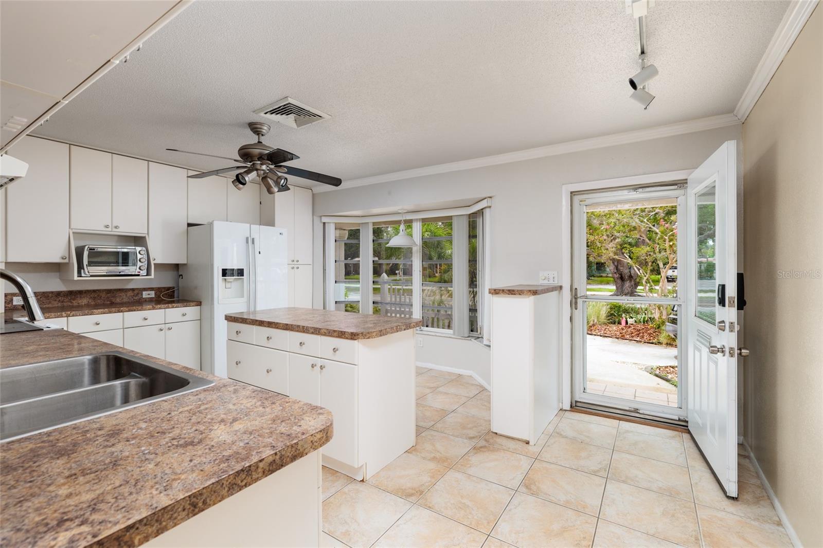 Bright kitchen with glass screen door