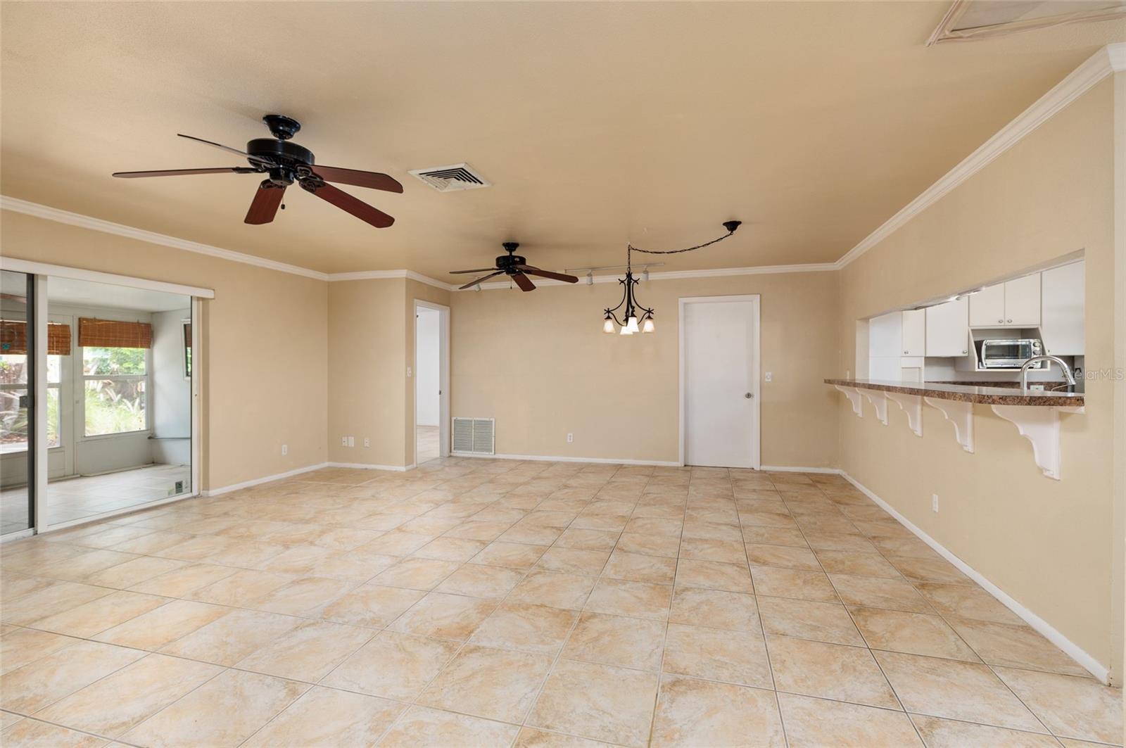 Living room and dining leading out to back patio