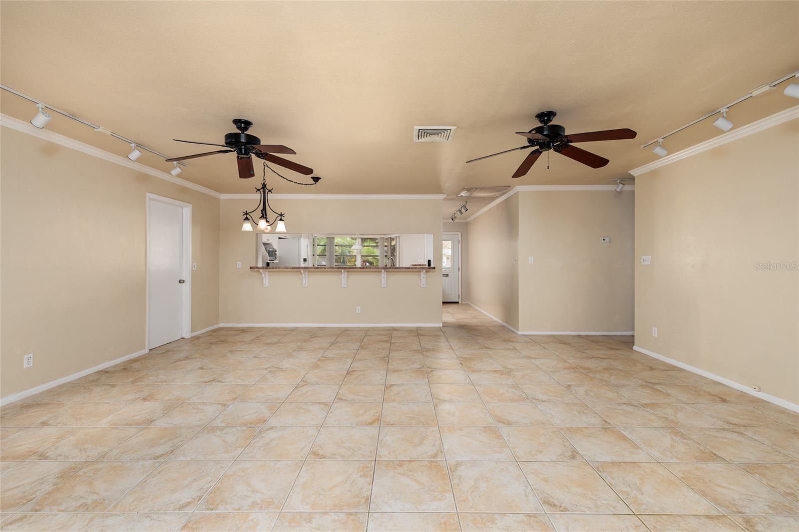 Counter has room for bar stools.  Consistent tile flooring throughout.