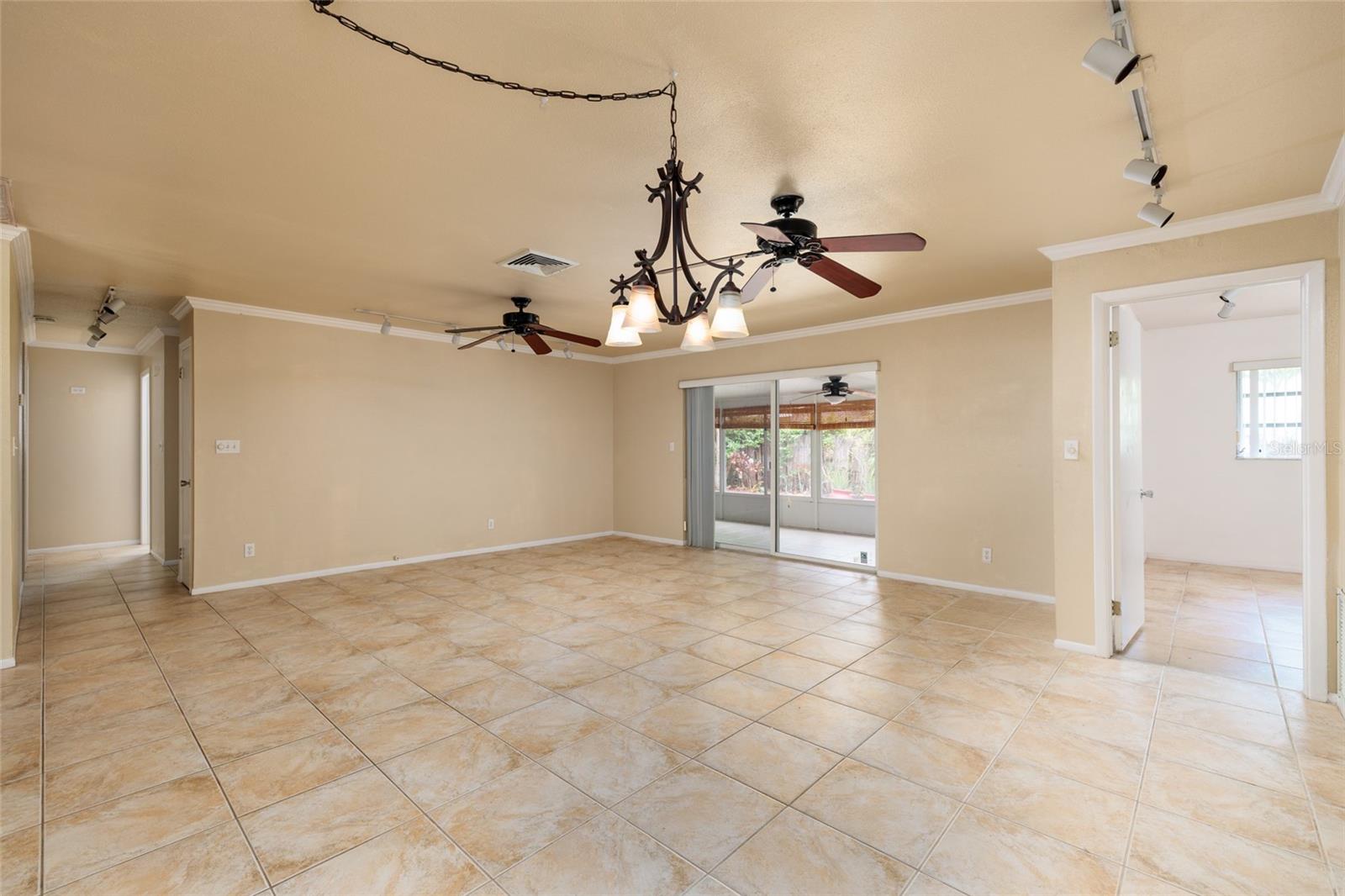 Primary bedroom off of living, dining room