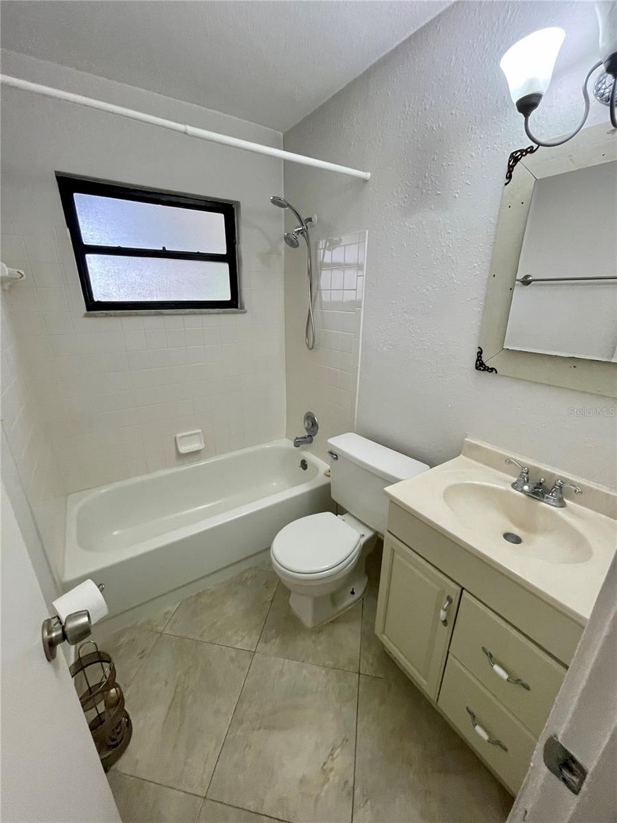 The start of the hall, you will find the guest bathroom, partially updated.