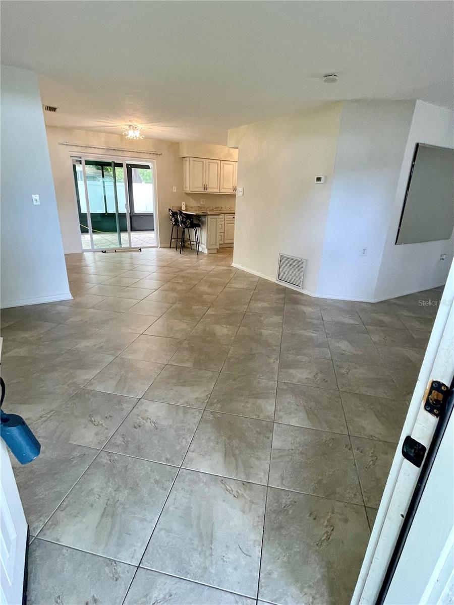 Walking into the living and dining room, family room to the right