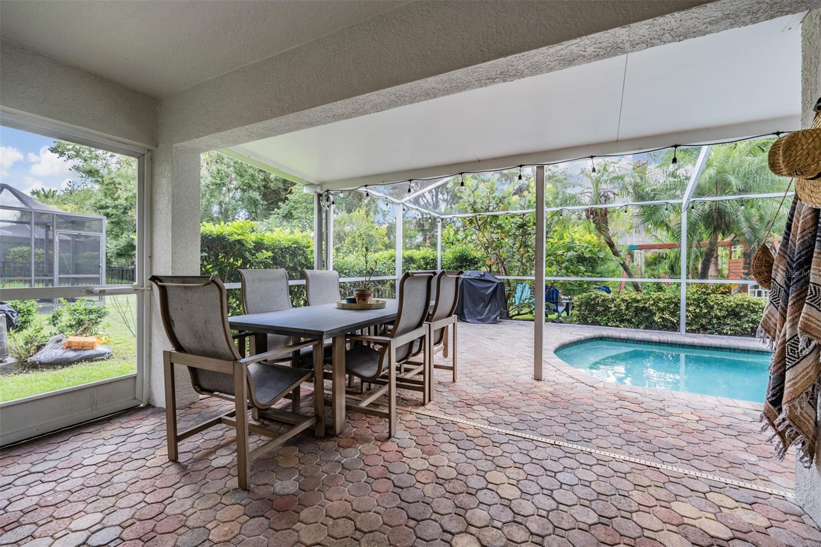 Screened-in lanai and dining area