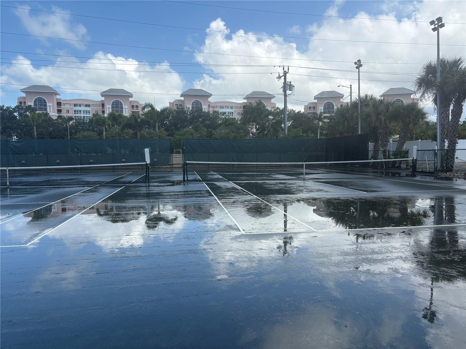 Our Clay courts getting watered