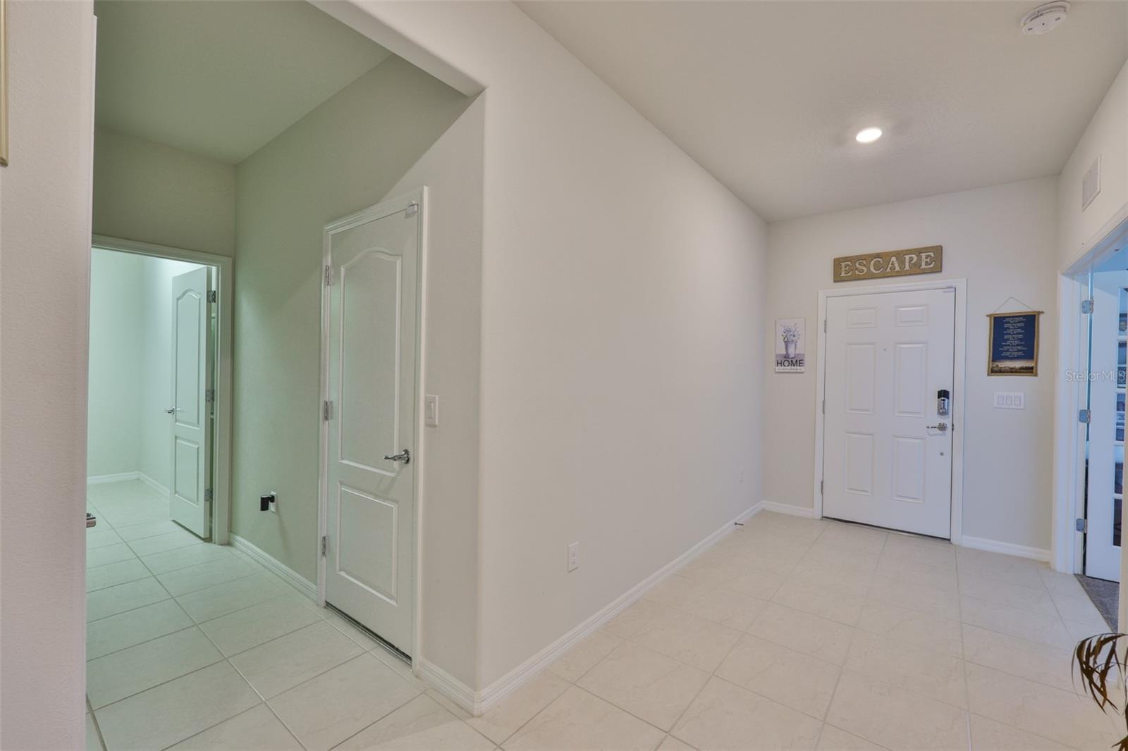 FRONT ENTRANCE AND PRIVATE LAUNDRY ROOM