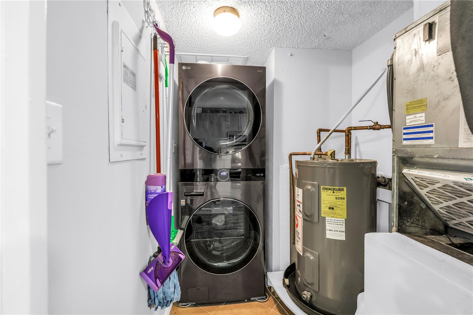 Spacious Laundry and Utility room with LG Washer/Dryer in 2022 and Water Heater in 2019.