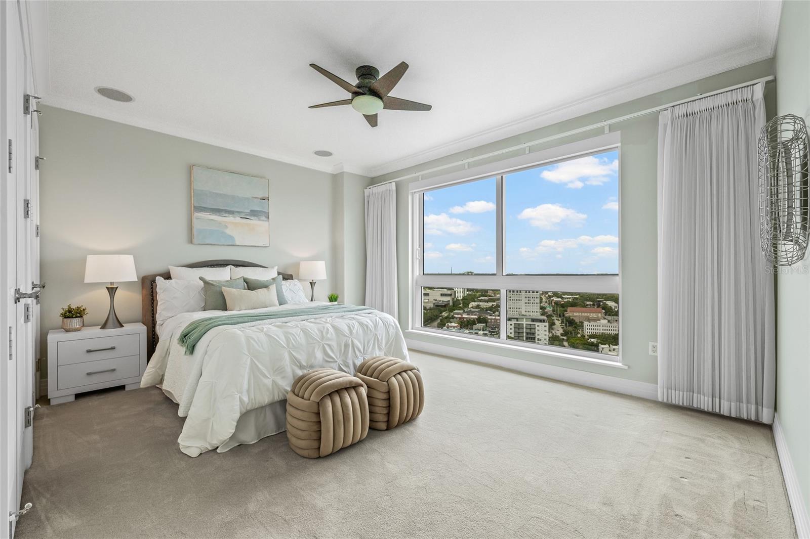 Guest bedroom with abundant natural light and beautiful Northeast views.