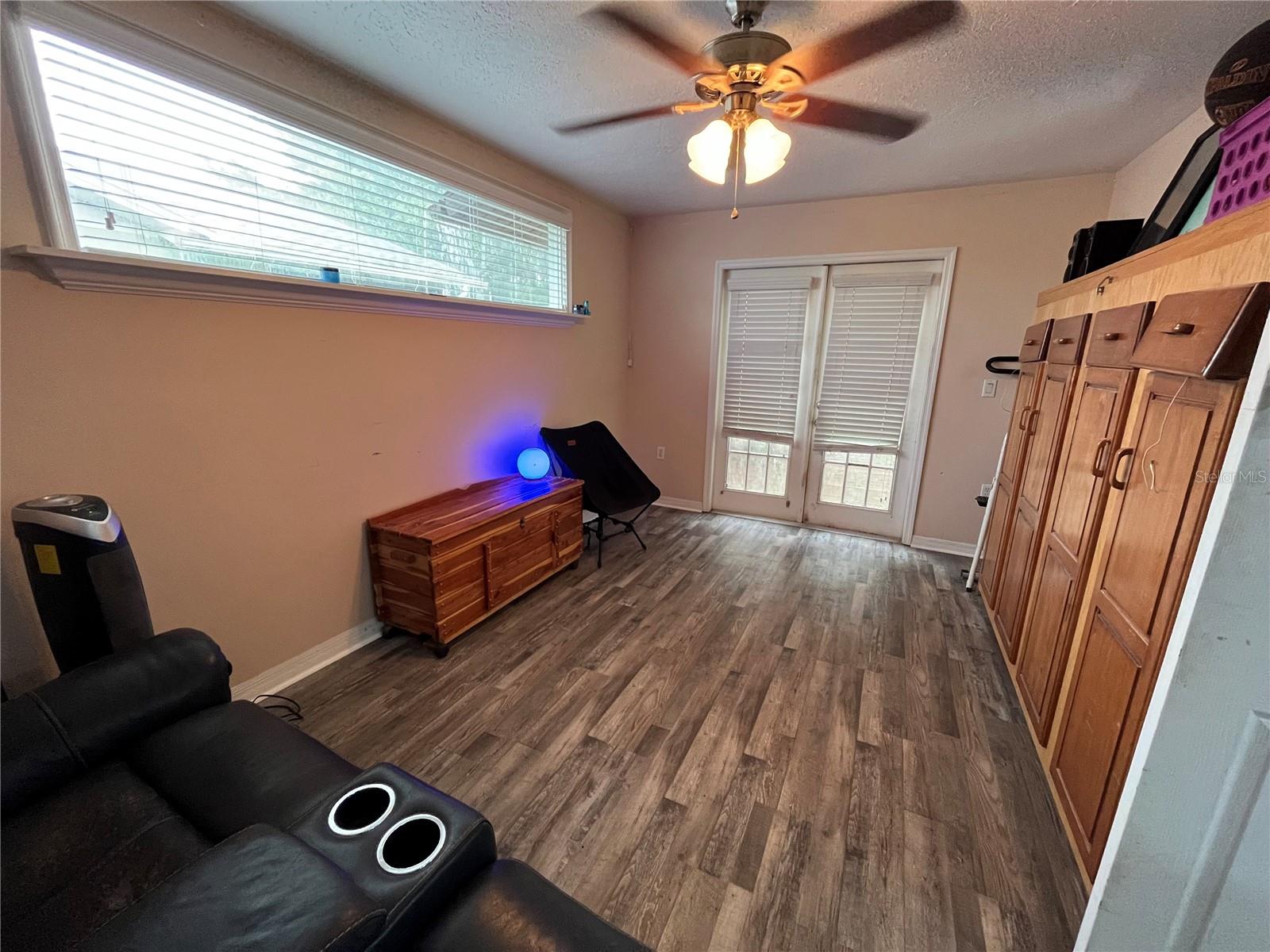 3rd bedroom/office w/ french doors to backyard
