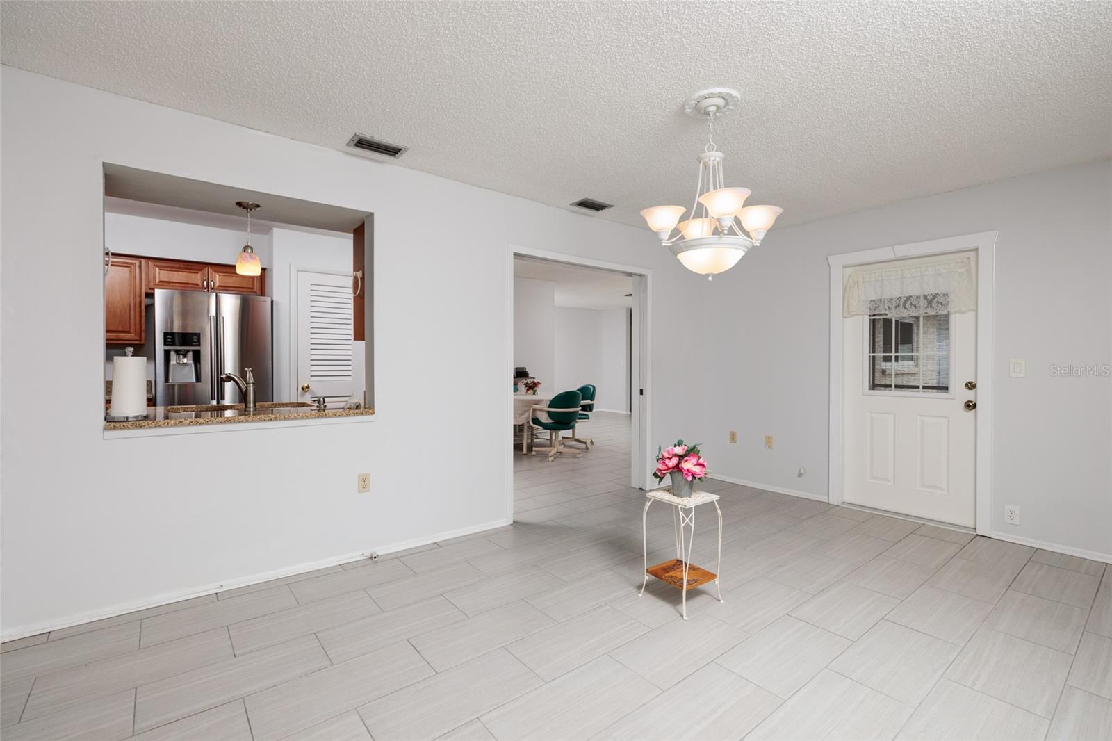 Dining/Sunroom to Kitchen and Patio