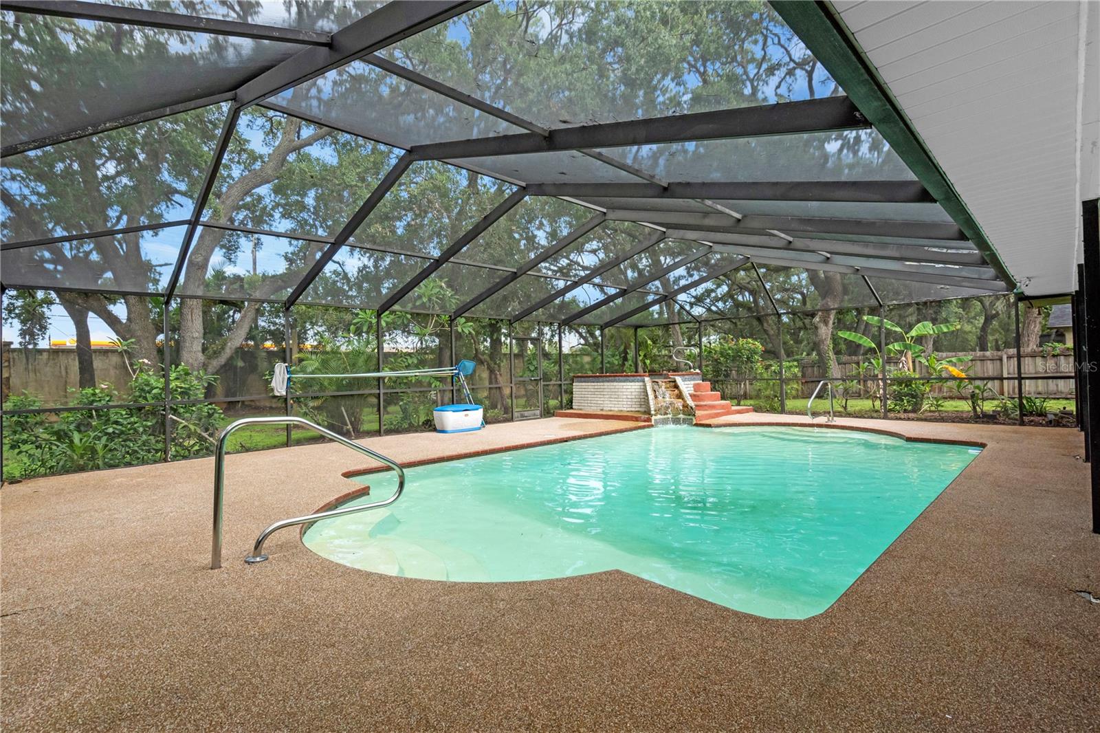 Another view of the patio space and pool.